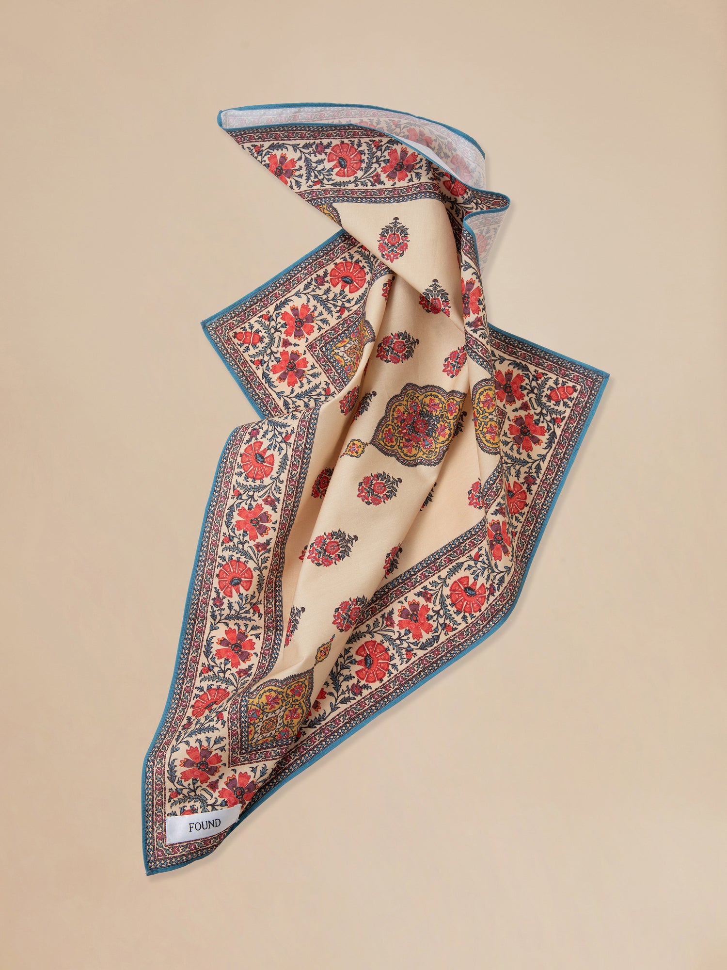 A Found Poinciana Bandana scarf featuring a floral pattern made with airy cotton blend.