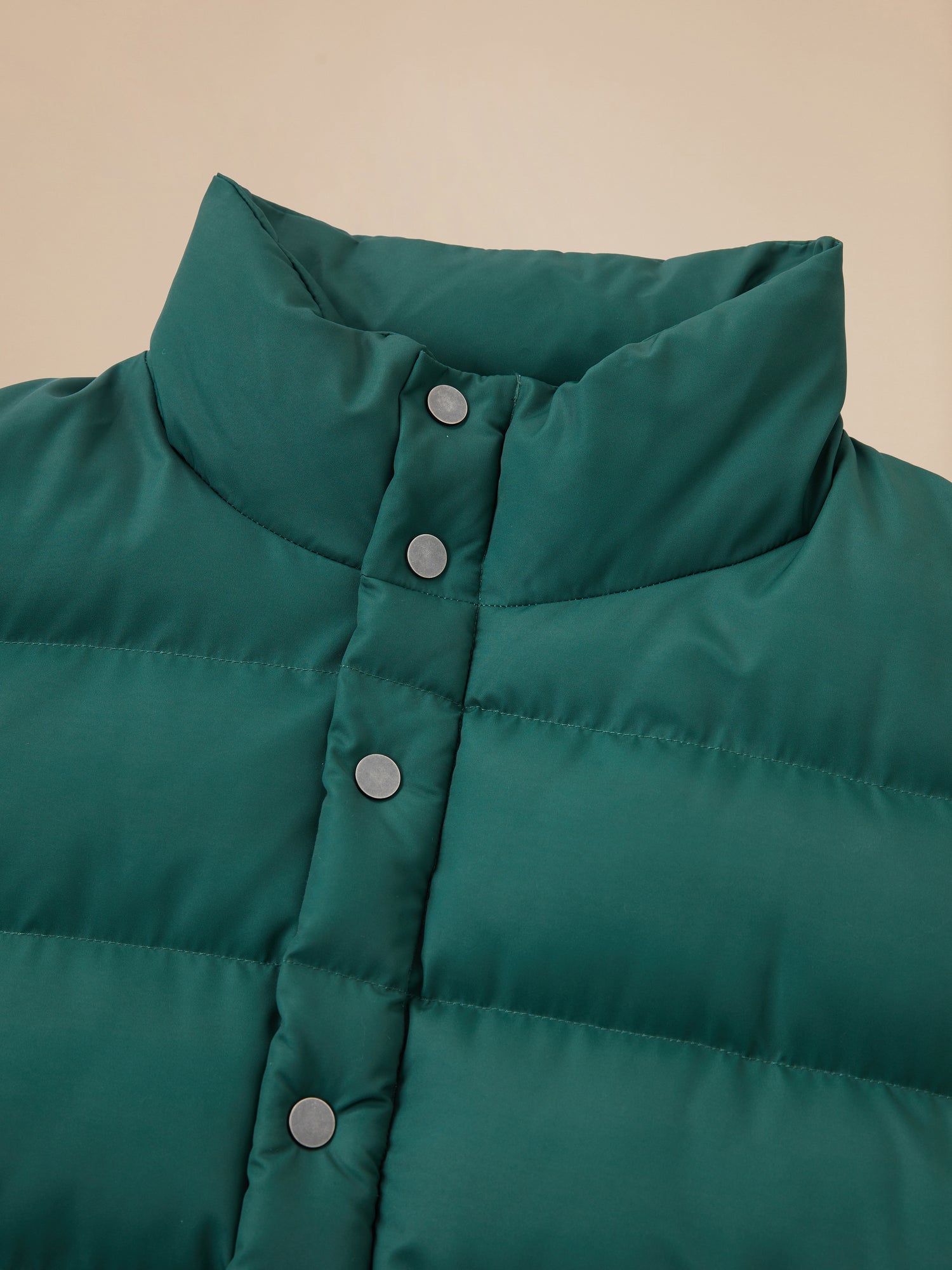 A close up of a Laurel Pine Puffer Jacket by Found.