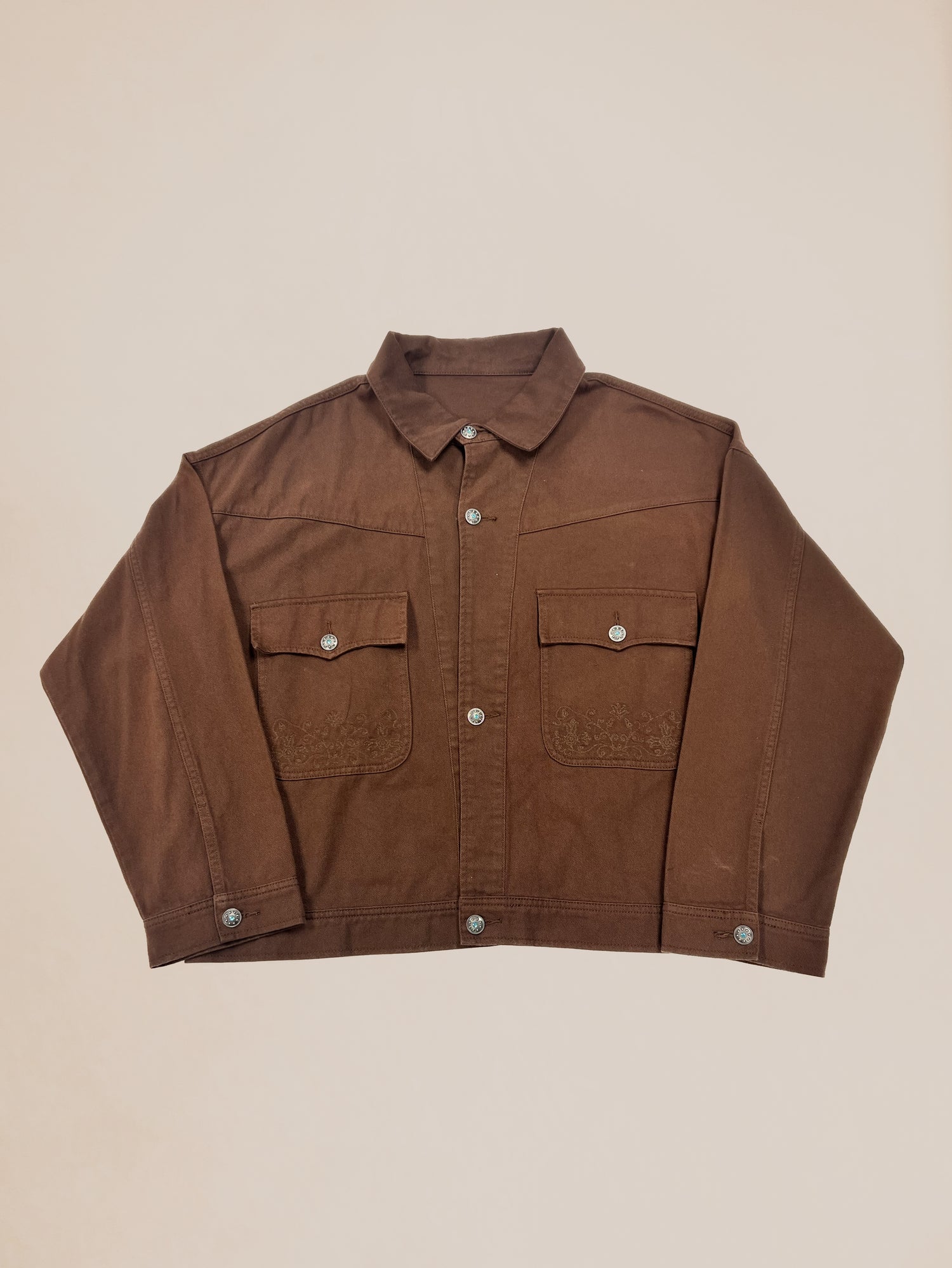 Brown cotton button-up Profound Sample 19 (Western Canvas Jacket) with chest pockets laid flat on a light background.