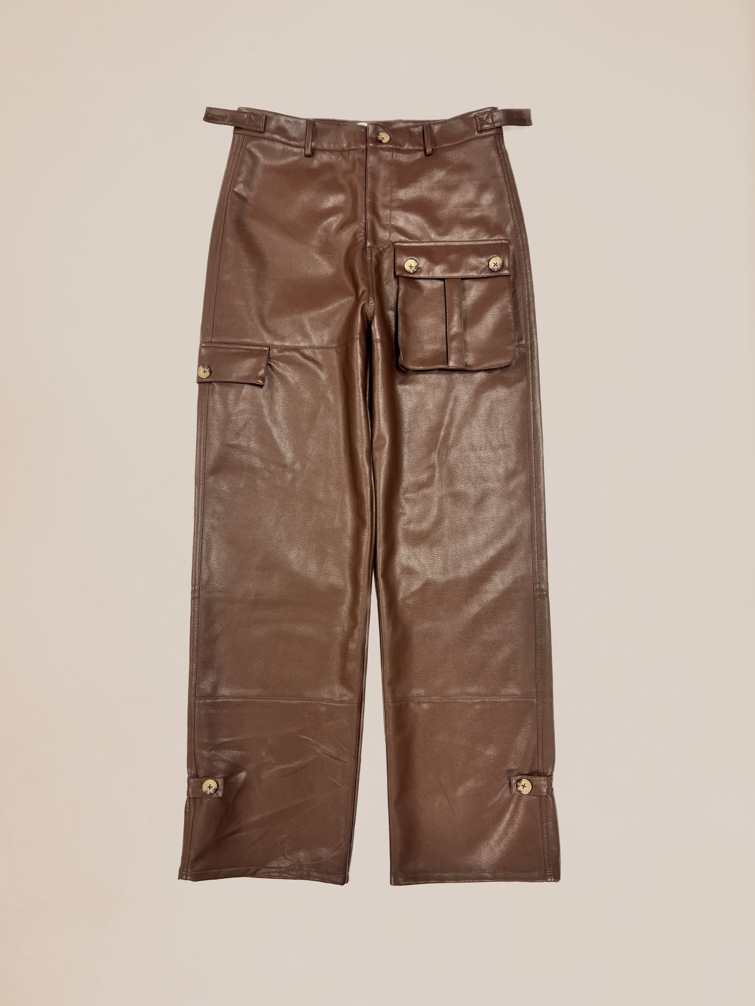 Profound Sample 29 faux leather cargo pants with front pockets and button closures.