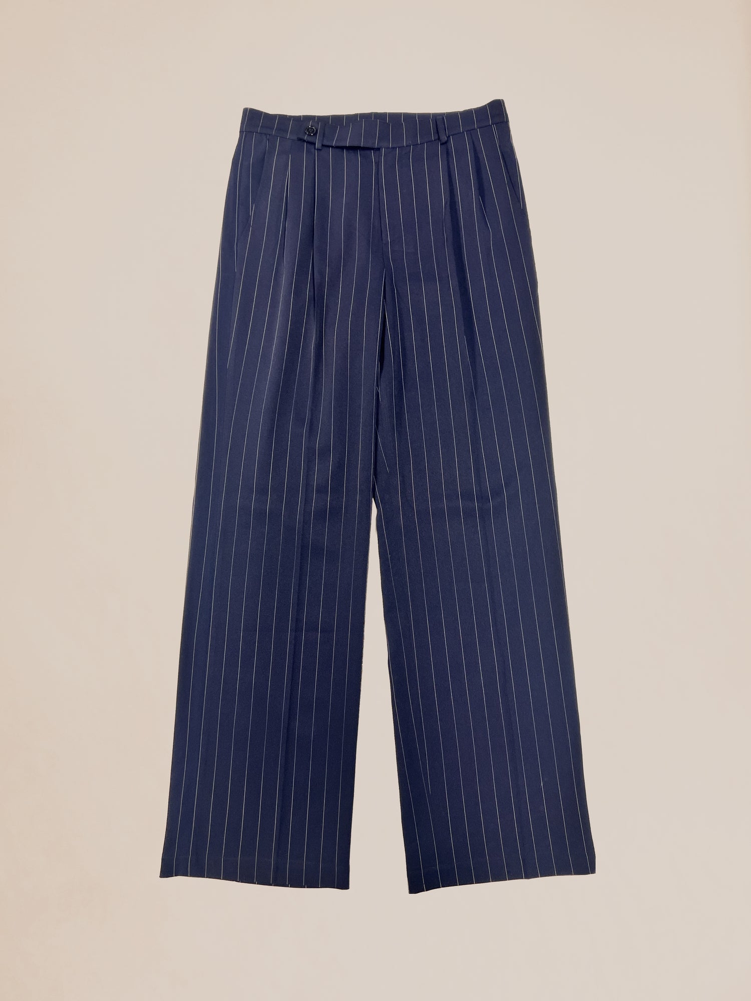 Profound Navy Pinstripe Trousers in size 32 waist on a neutral background.