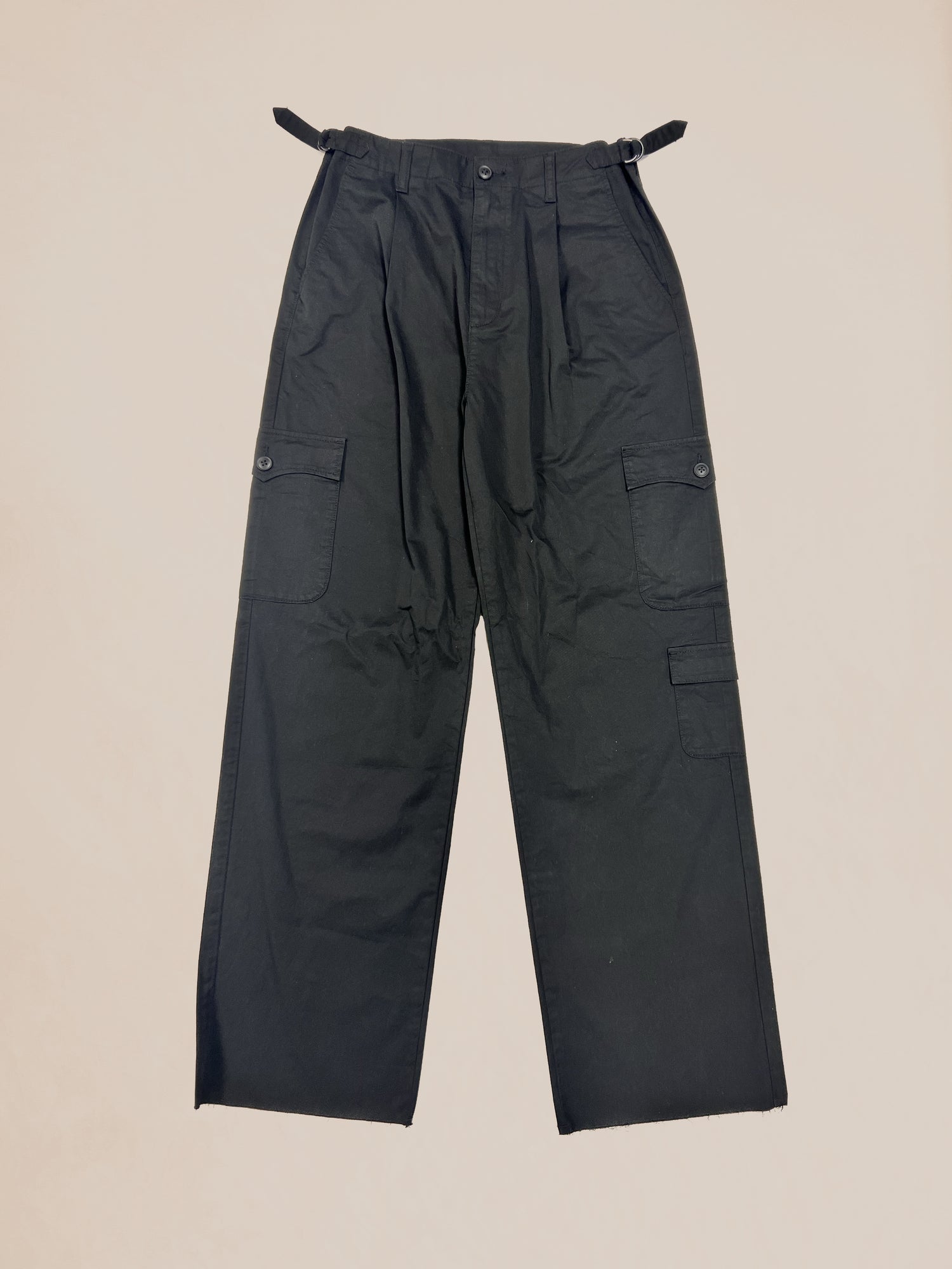 Black nylon cargo pants with side pockets displayed on a neutral background, waist 32.