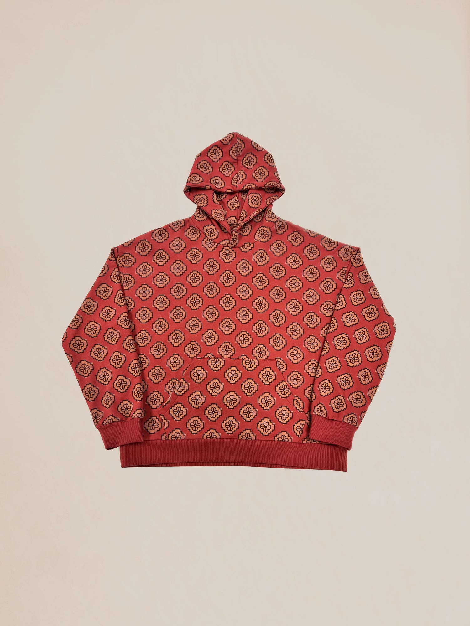 Pre-production Sample 43 of a red monogram patterned hooded sweatshirt displayed on a plain background by Profound.