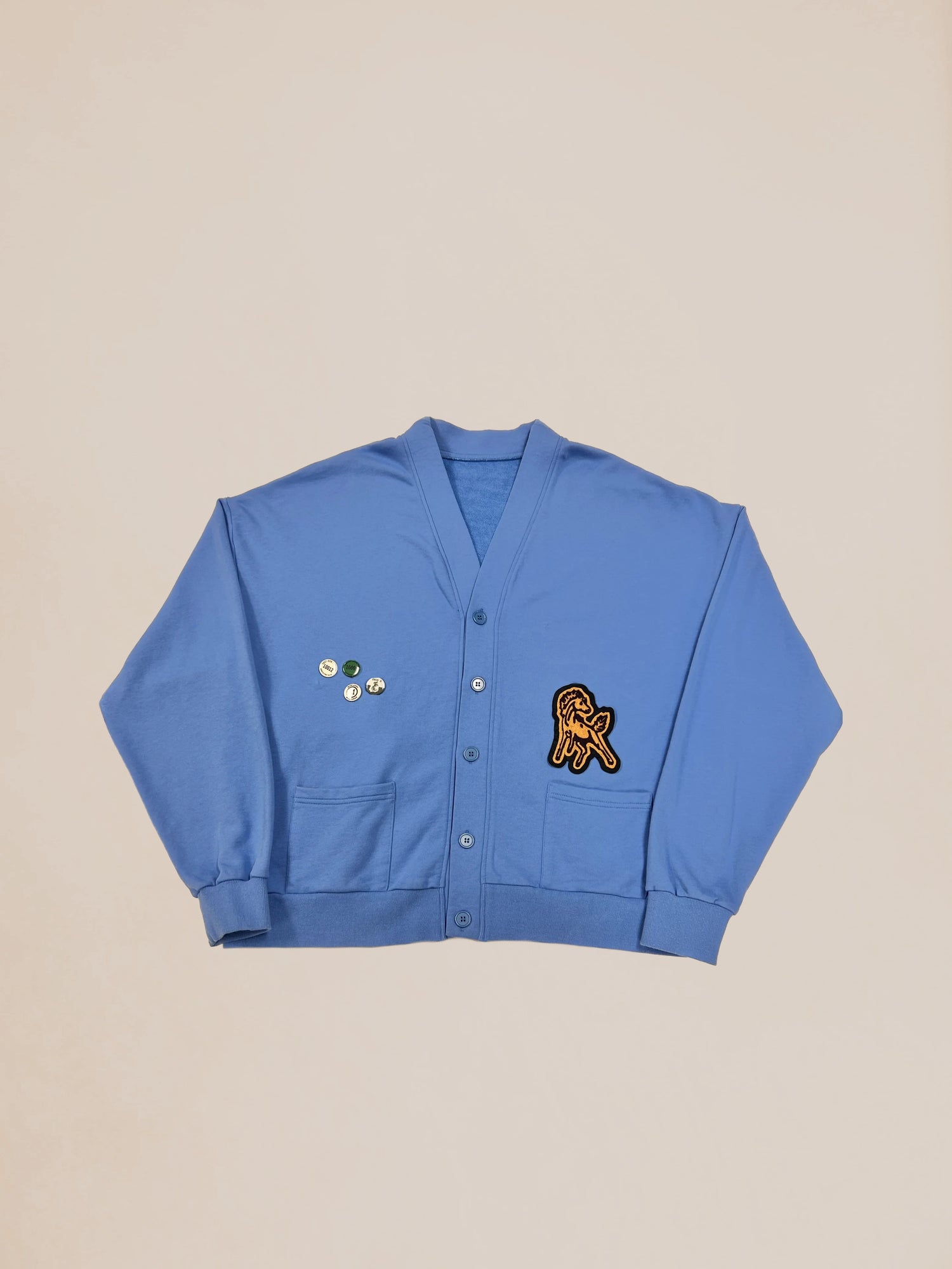 Blue Profound Sample 44 varsity patch cardigan with patches displayed on a neutral background.