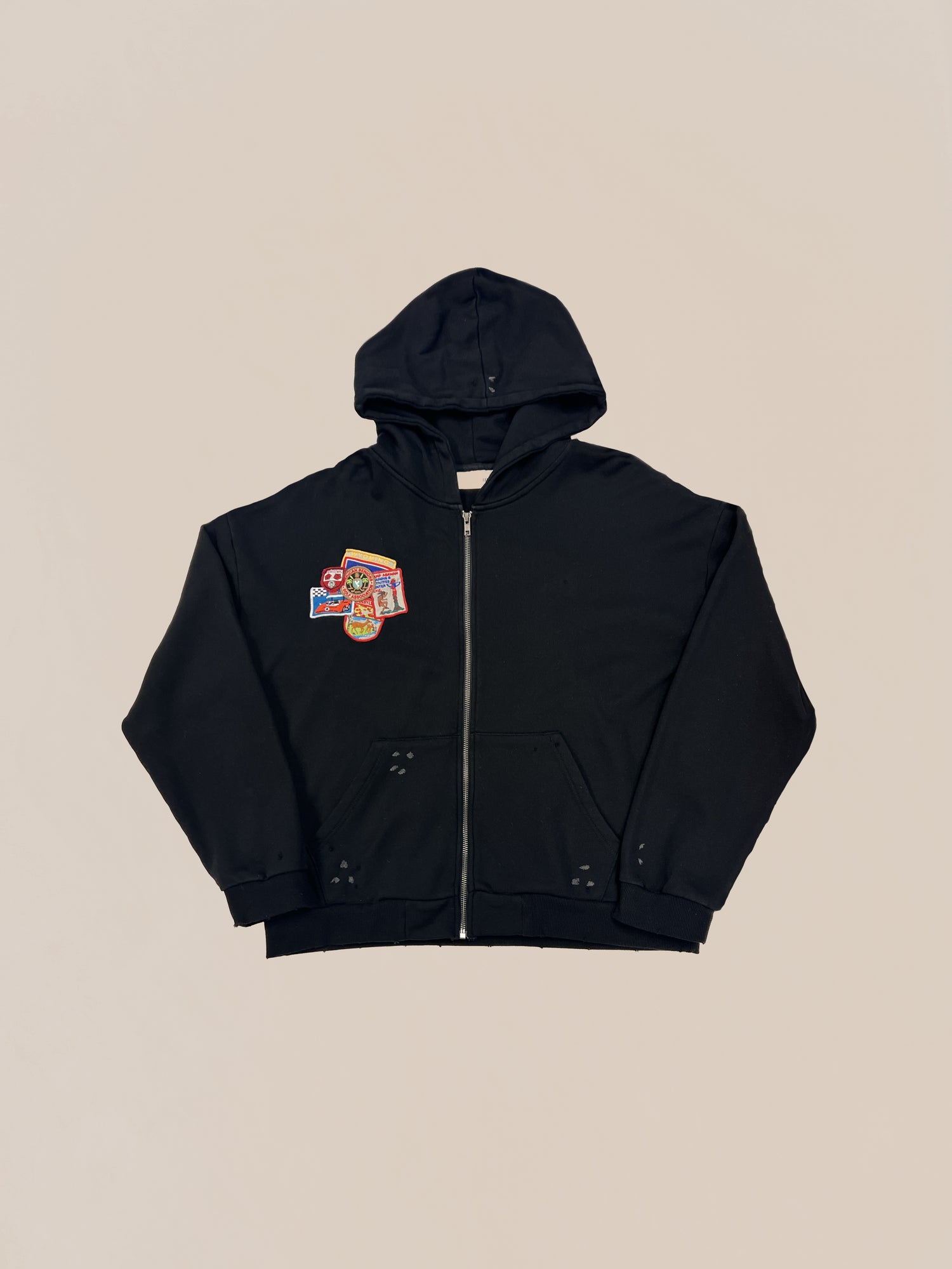 Black Sample 60 (Graphic Doodle Hoodie) with zipper and a colorful patch on the left chest displayed against a plain background. This is a Pre-production Sample by Profound.