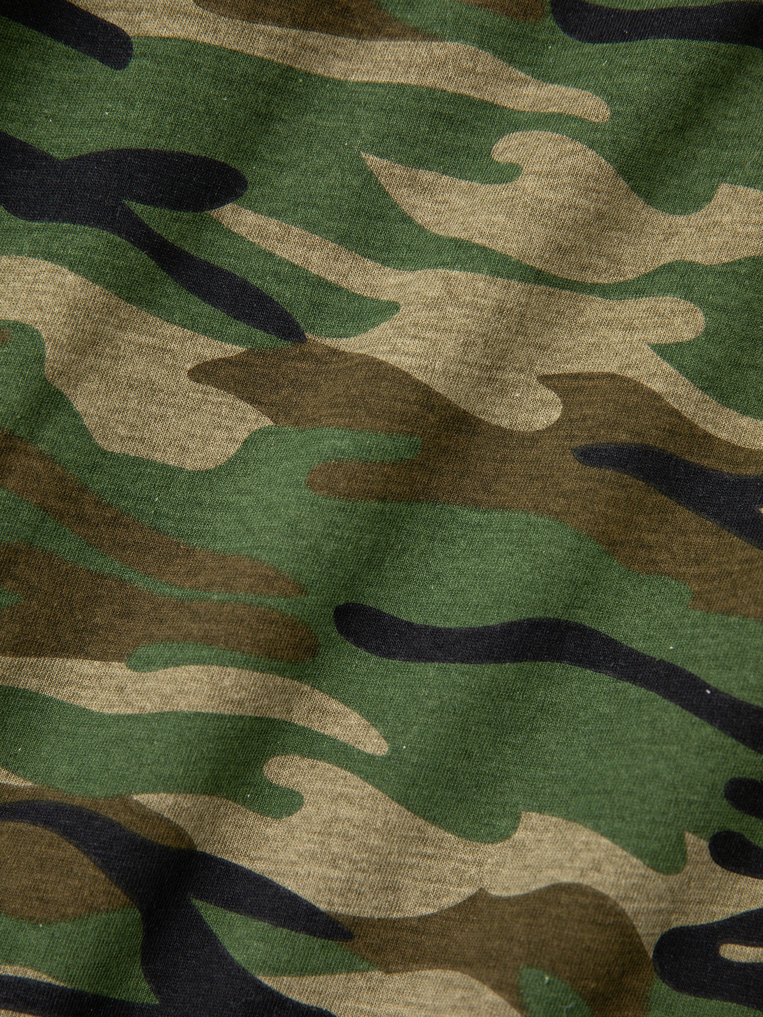 Close-up of the Double Layer Hoodie by FOUND, showcasing its green, brown, and black camouflage fabric with a wavy pattern that evokes a vintage look.