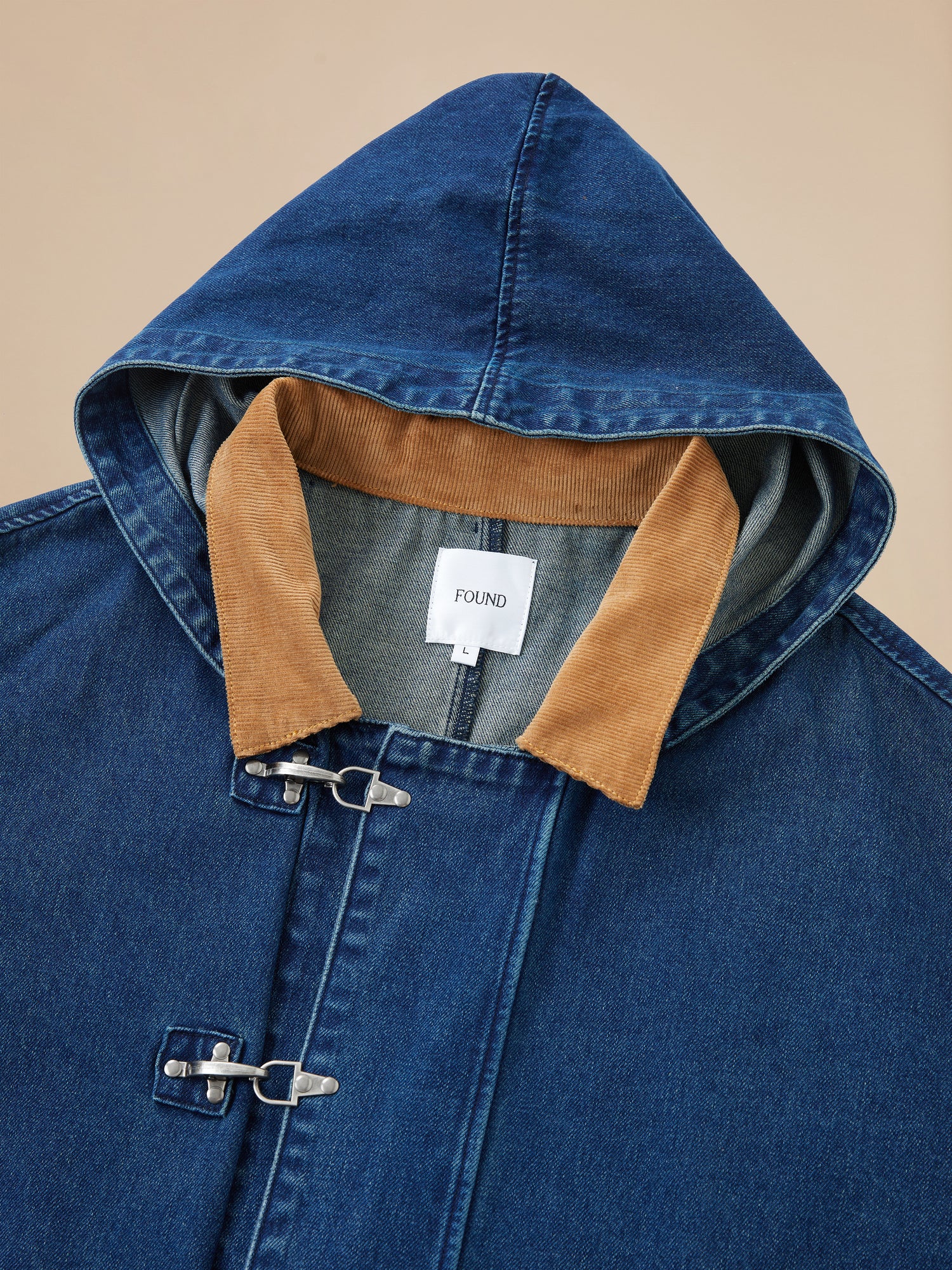 A Sargasso Denim Buckle Coat by Found with a hood.