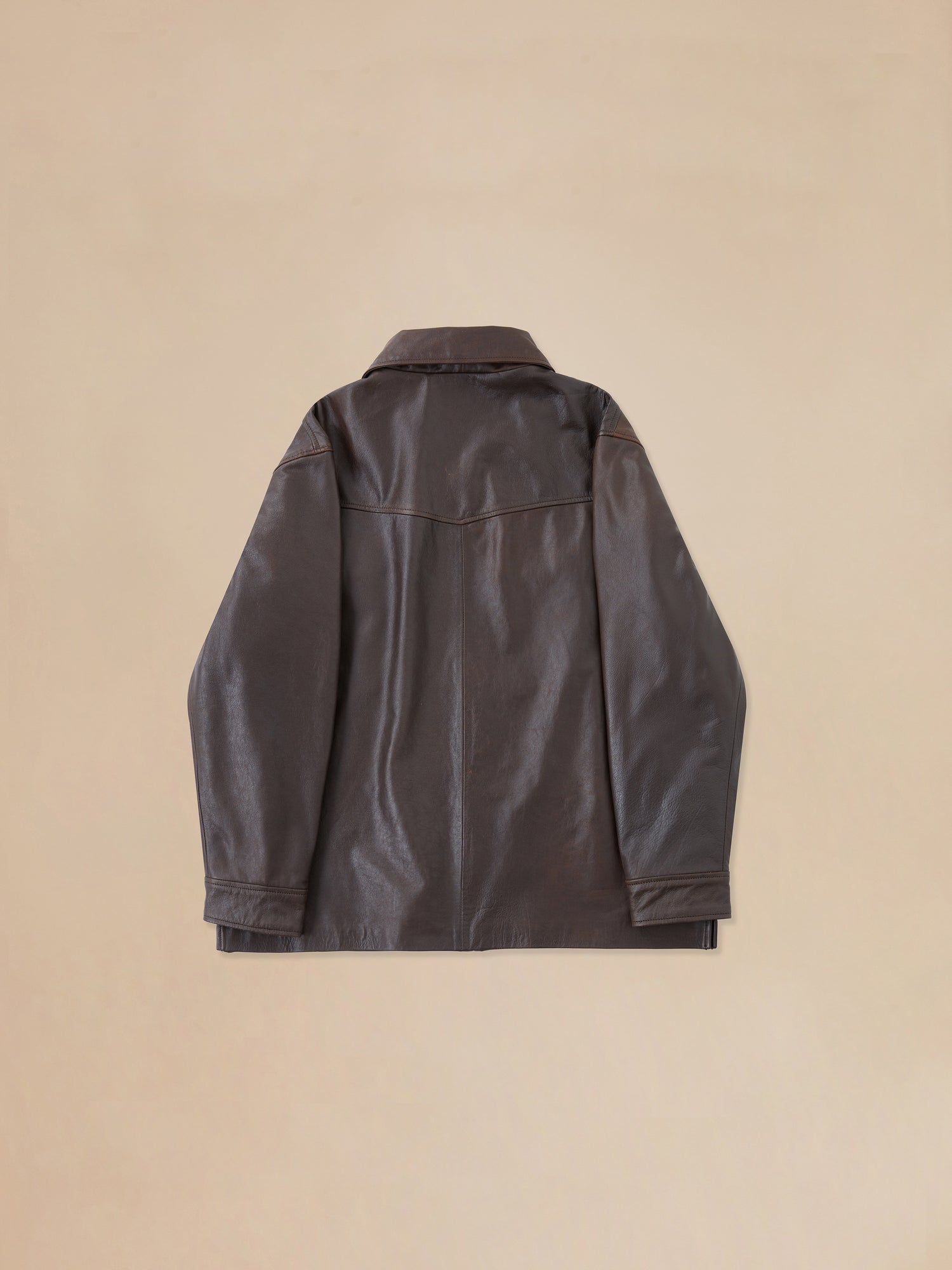 The back view of a Sepia Leather Overshirt by Found.