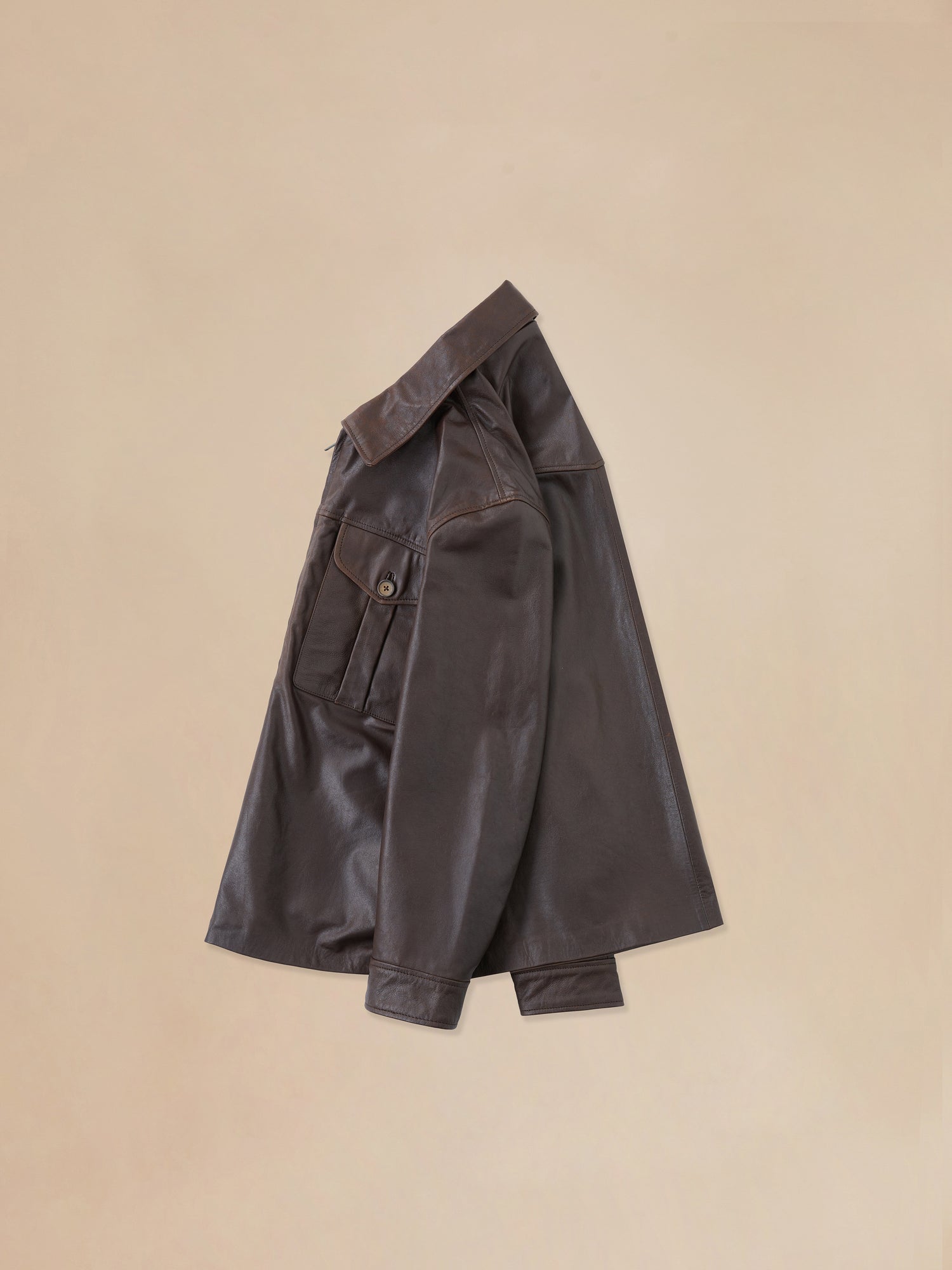 Side view of the sepia leather overshirt from Found's Fall 2023 collection