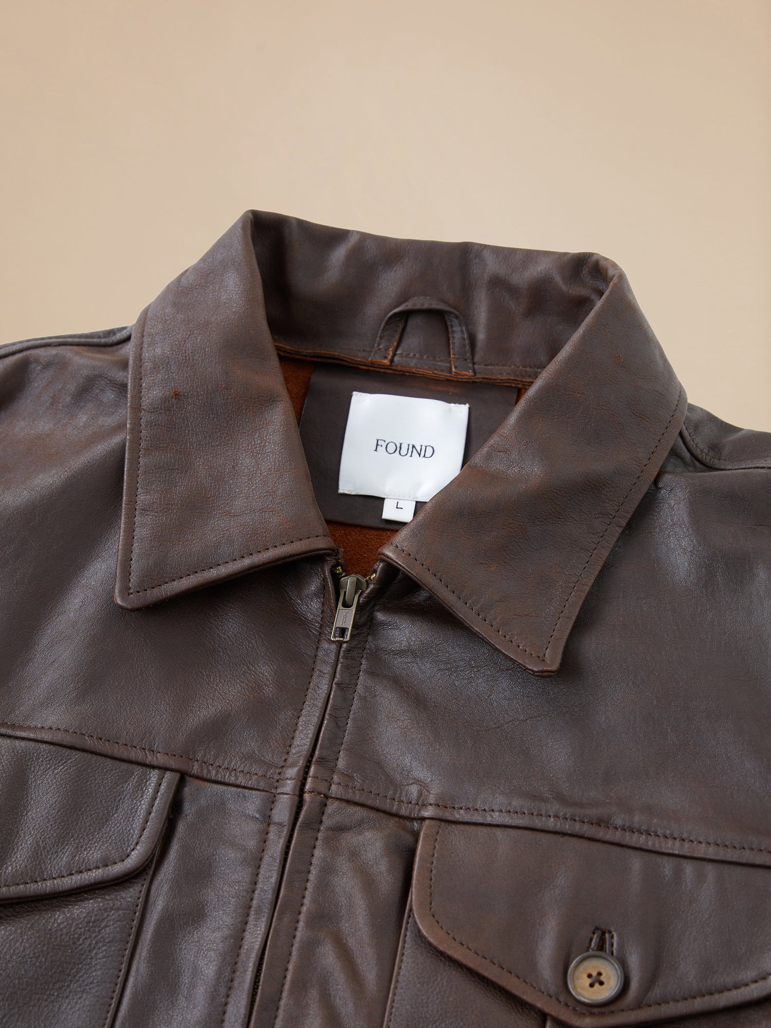 A close up of a Found Sepia Leather Overshirt.