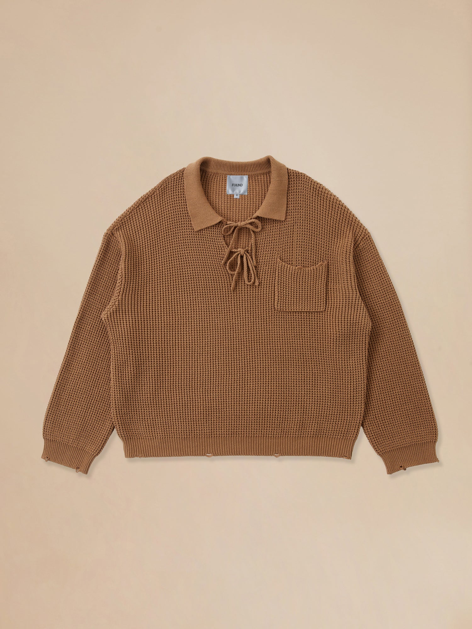 A cozy Found Tie-Collar Knit Sweater with a pocket on it.
