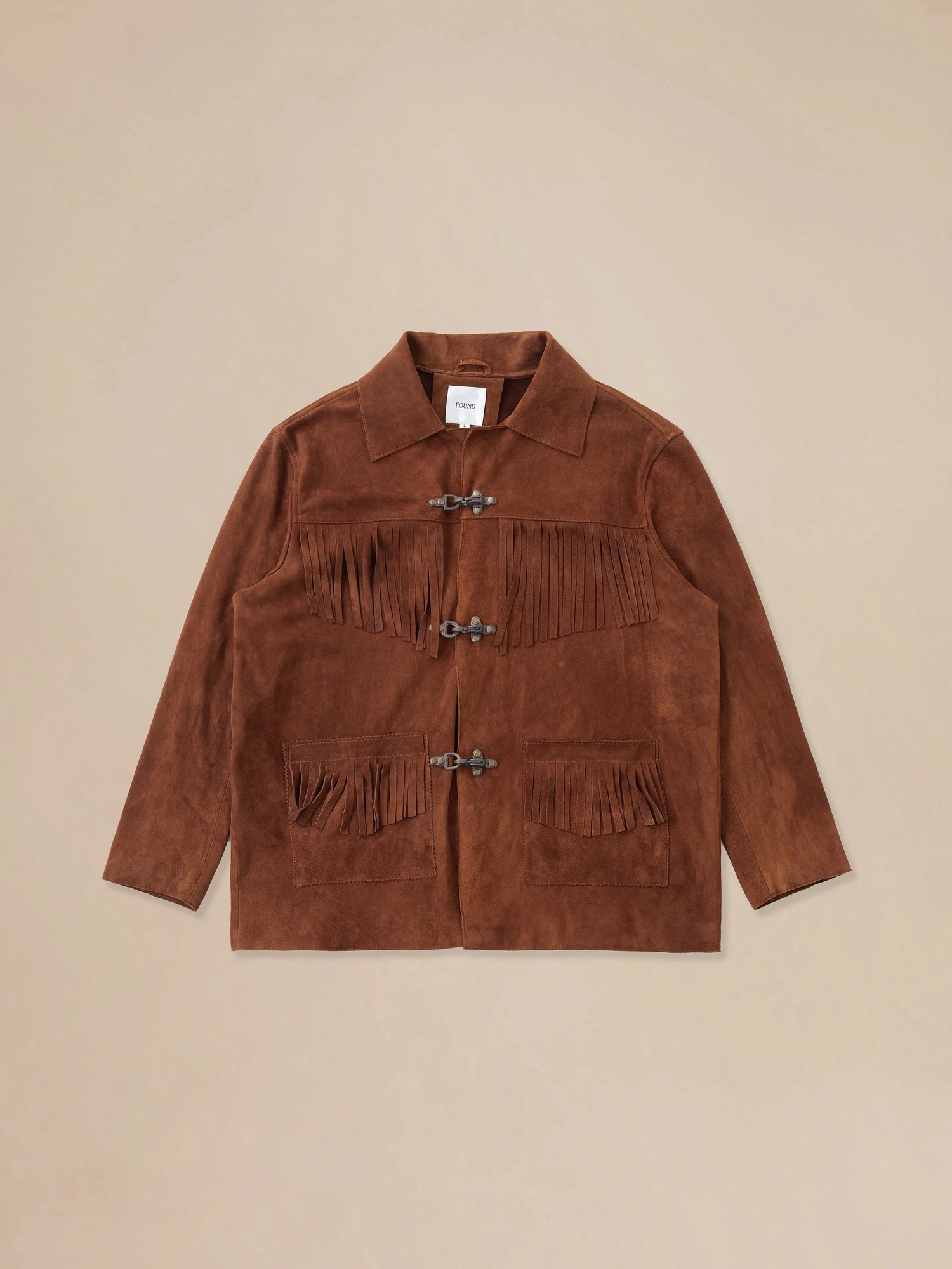 A Found Tobacco Fringe Suede Buckle Jacket with fringes.