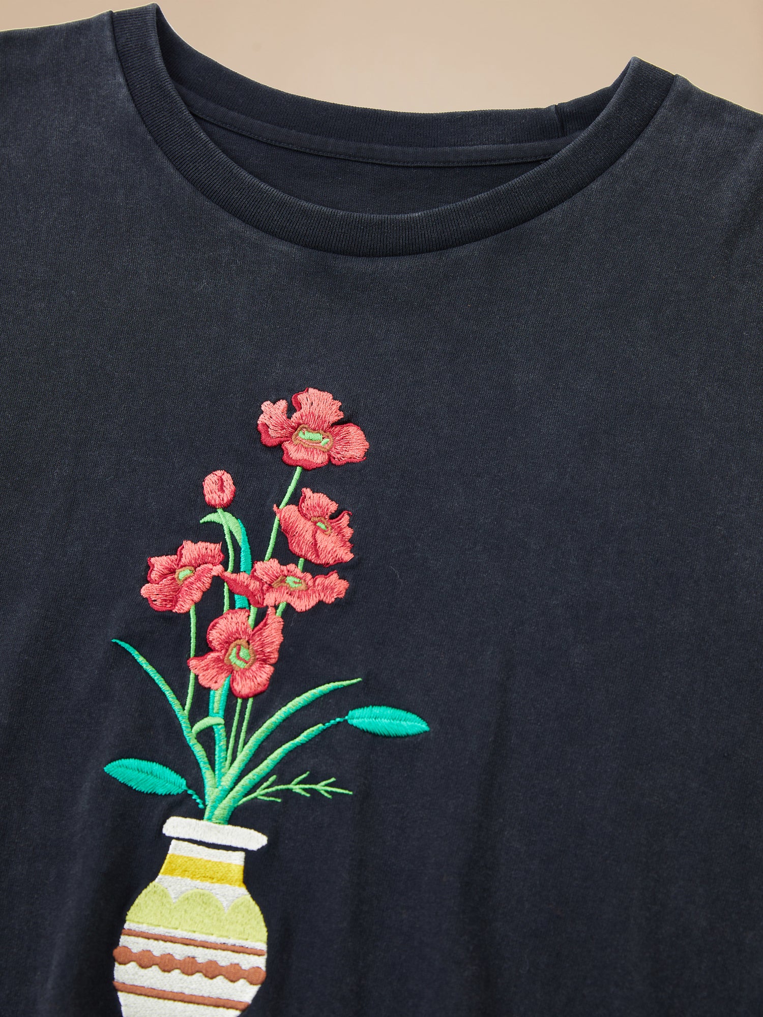 A Flowers Vase Tee, adorned with embroidered flowers from Found.