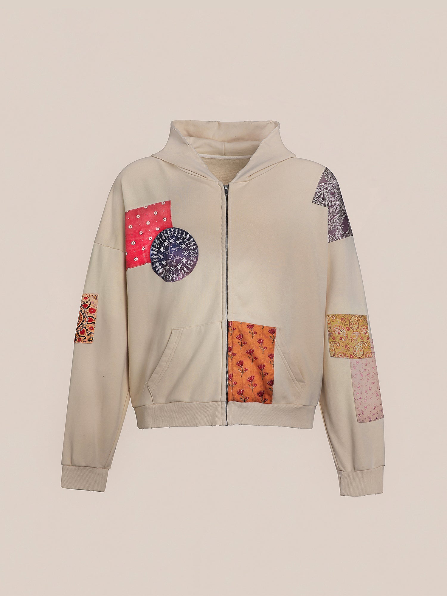 The Tapestry Patchwork Zip Up Hoodie by FOUND features an oversized fit with a front zipper and vivid South Asian tapestry designs on the sleeves and front.