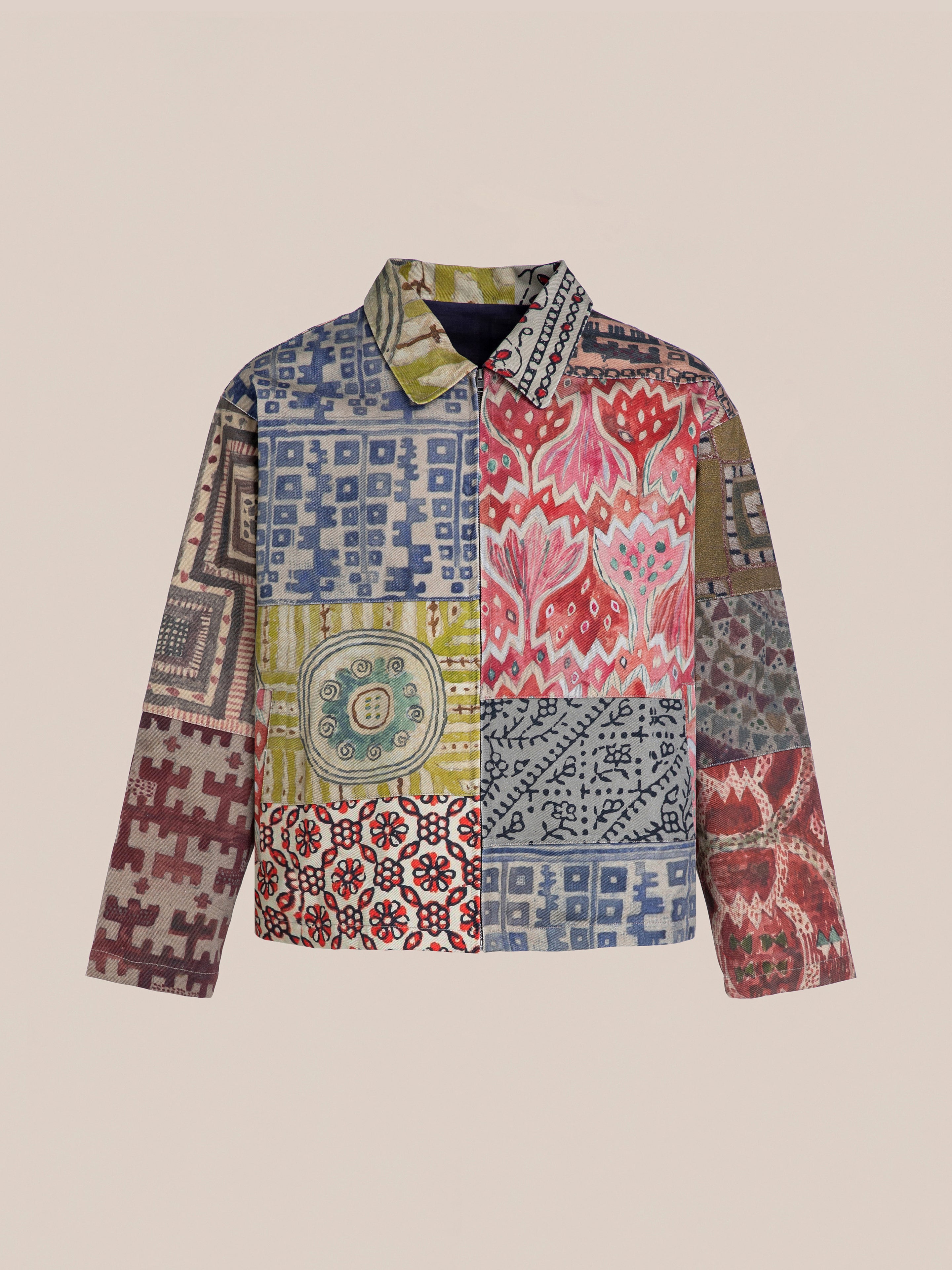 The FOUND Watercolor Mosaic Work Jacket is a unisex masterpiece, showcasing vibrant geometric and floral patches on beige, perfect for adding artistic flair and versatility to any wardrobe.