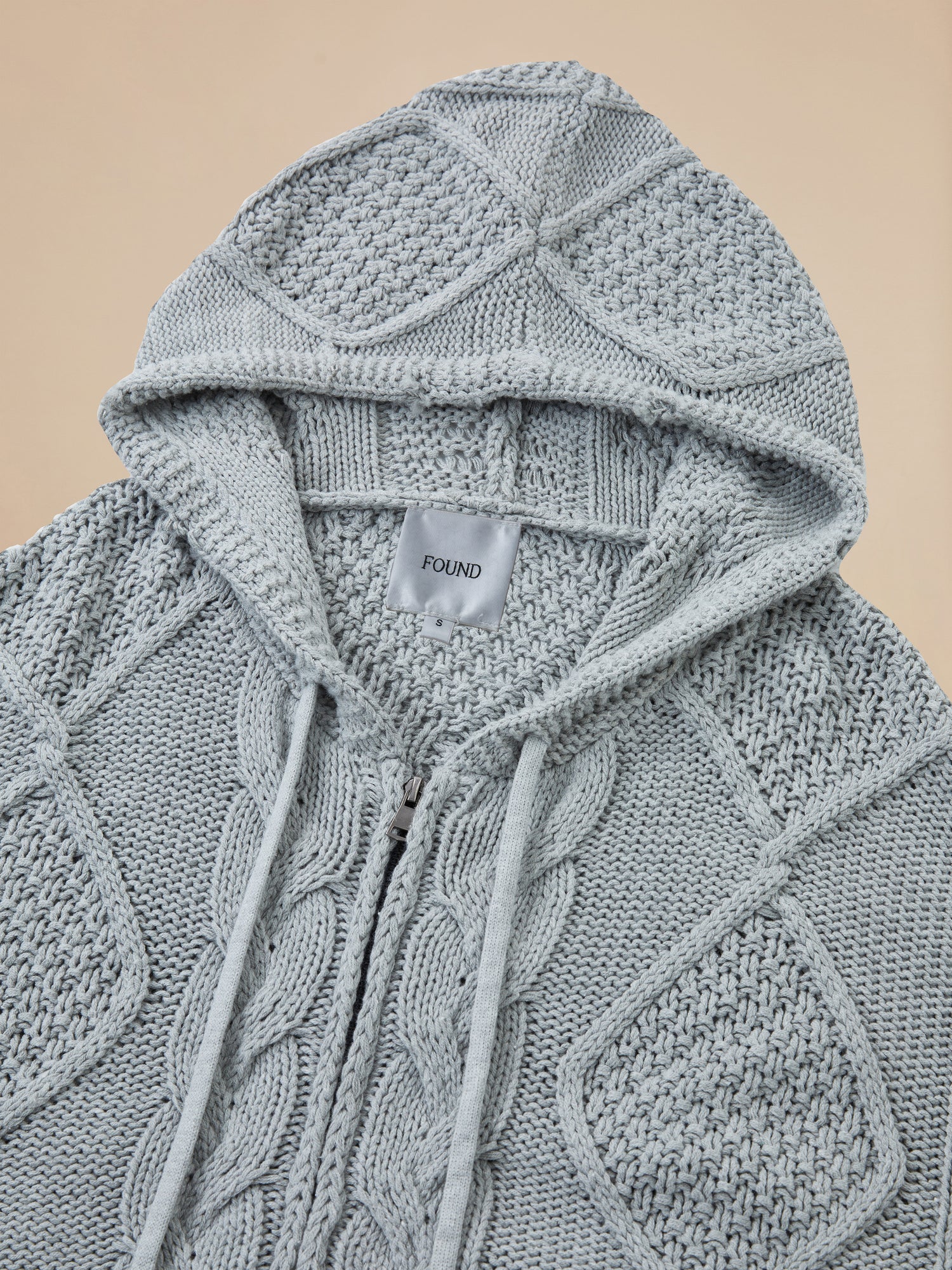 A warm Found Zip Up Distressed Cable Knit Hoodie for comfort.