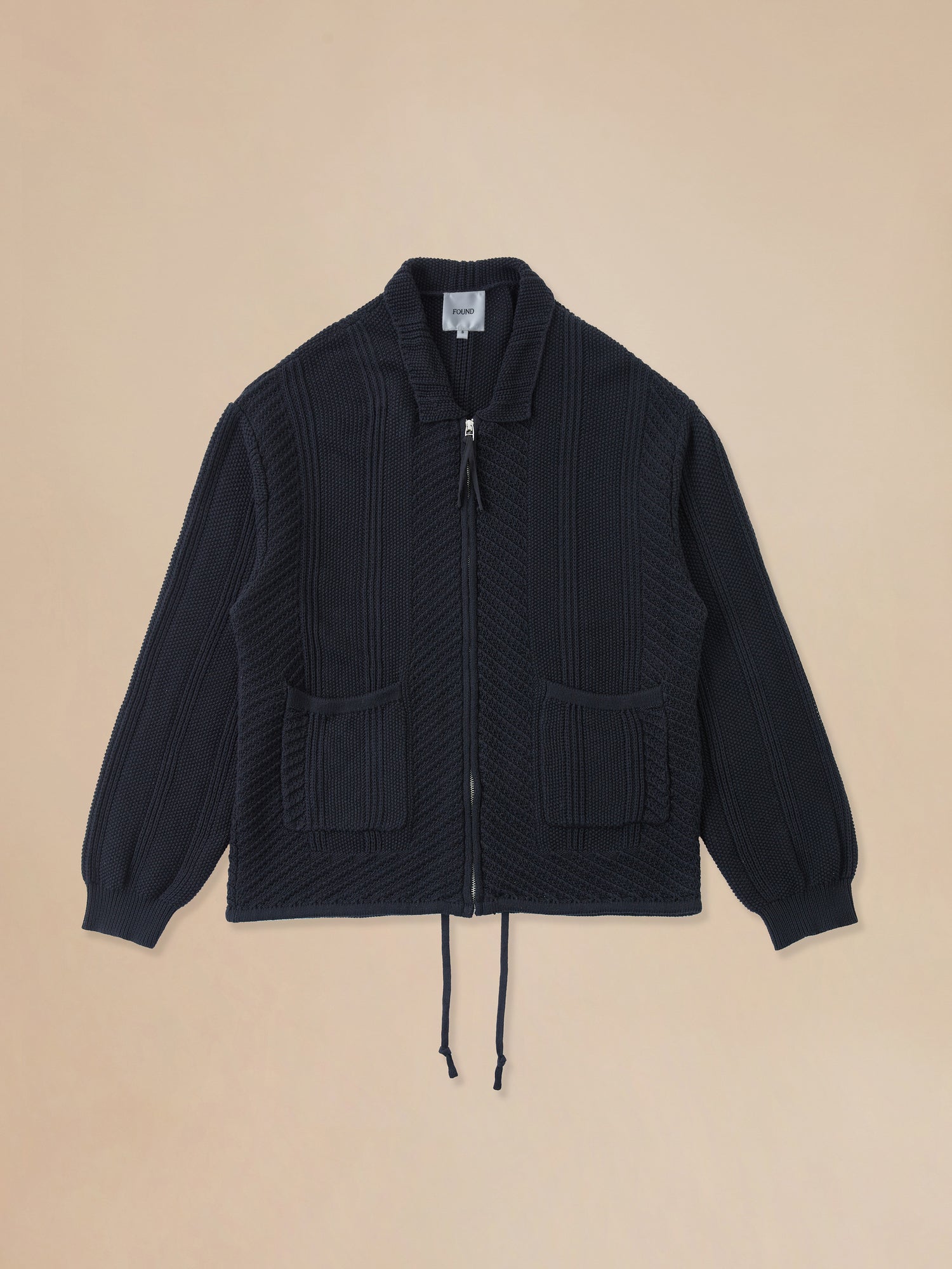 A Found black Zip Up Panel Knit Ribbed Sweater with cable-knit detailing.