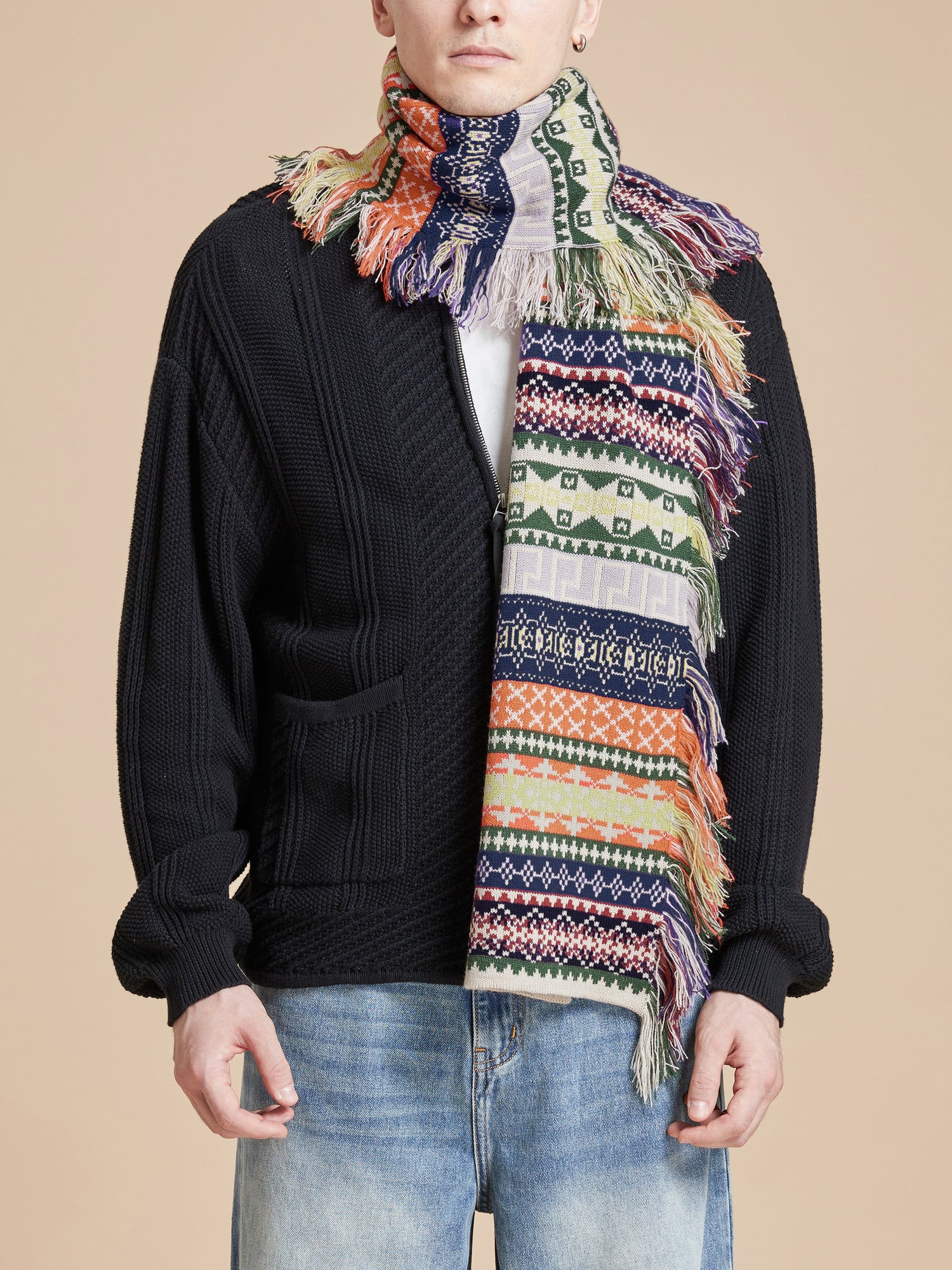 A man wearing a hand-distressed Found Isles Scarf.