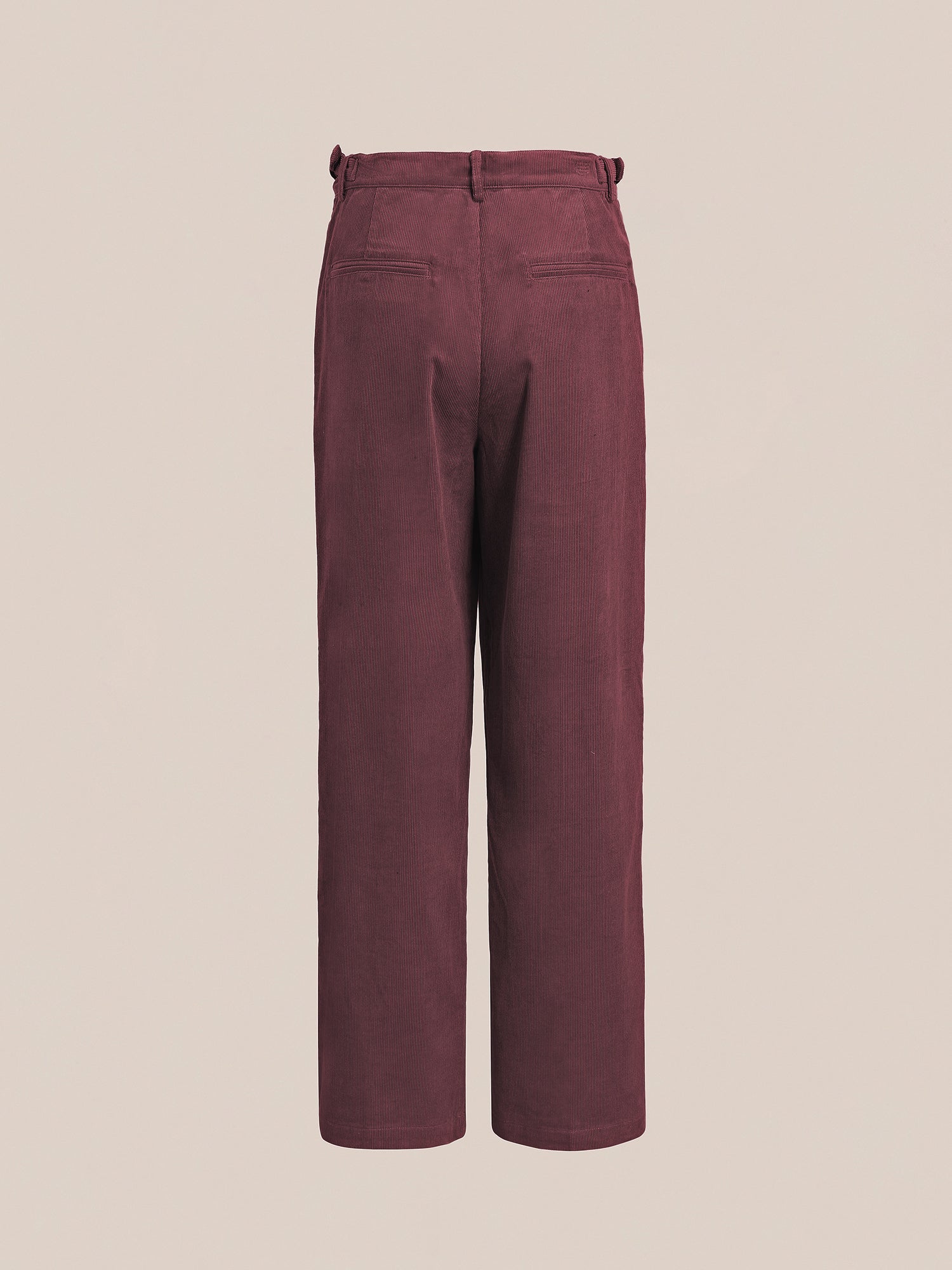 Back view of the Corduroy Pleated Trouser by FOUND, featuring a high-rise waist, belt loops, and two welt pockets, set against a neutral background.