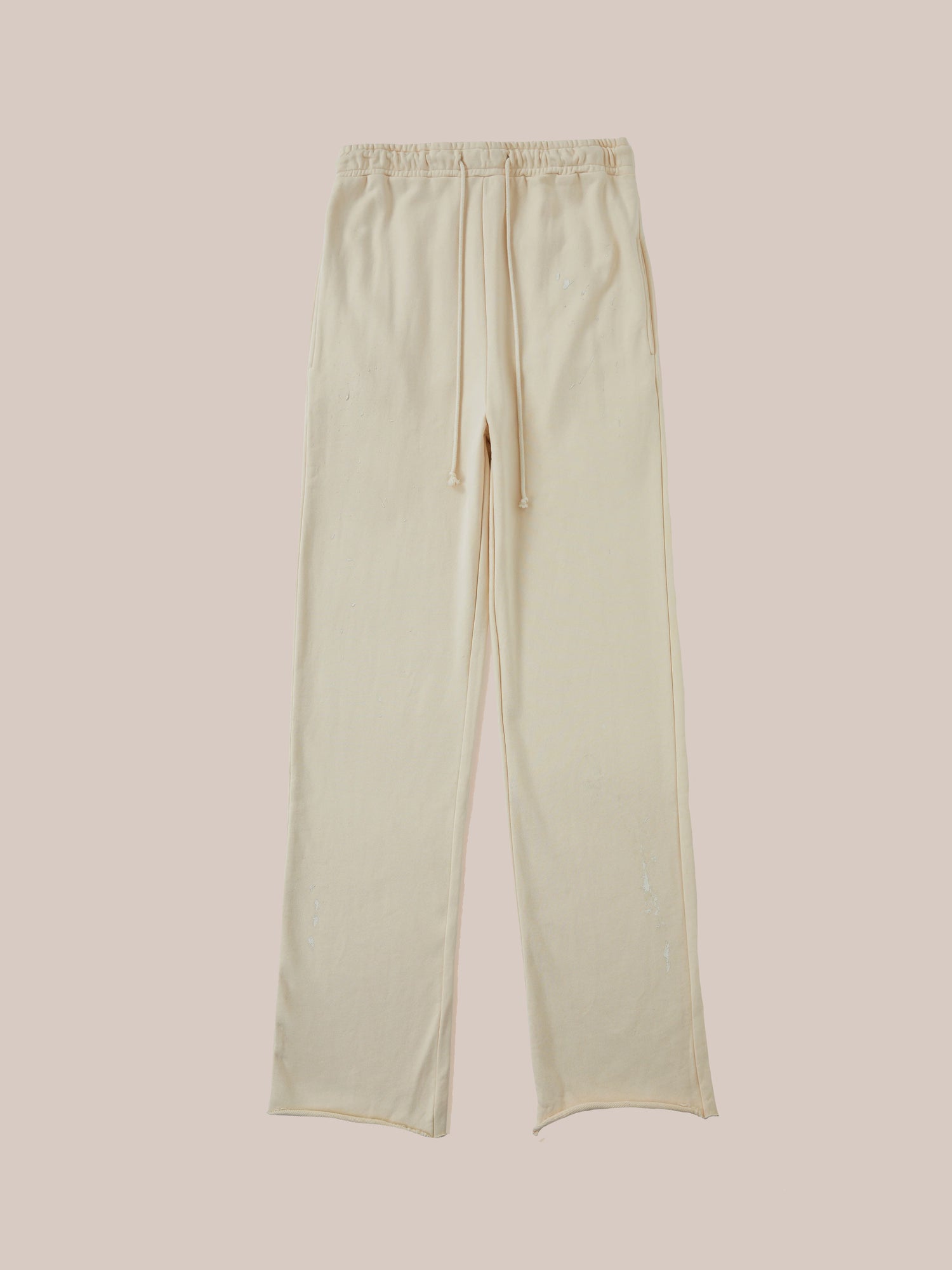 A pair of Found Sandshell Lounge Pants with an elastic waistband, displayed flat against a pale pink background.