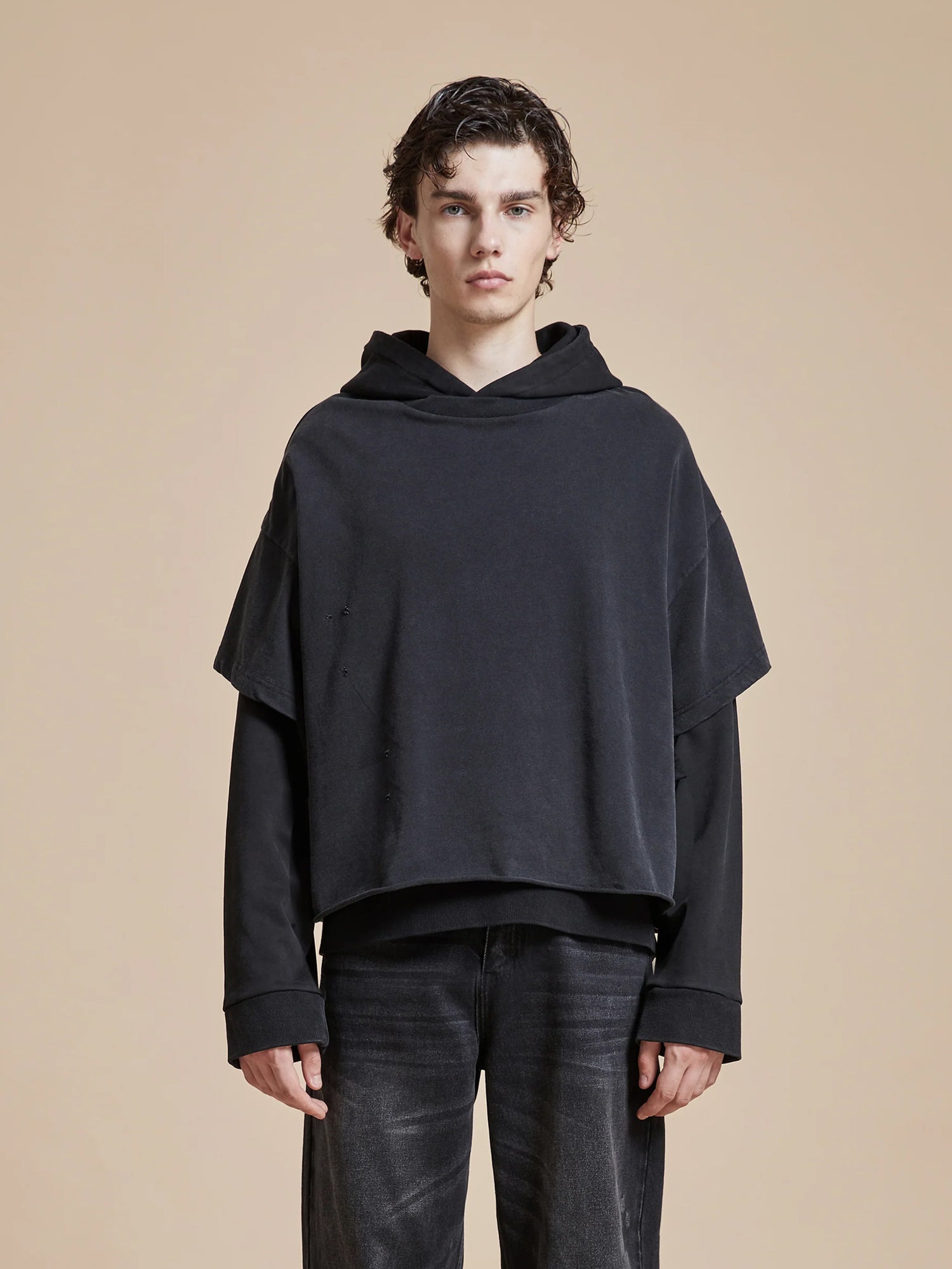 The model is wearing a Found Double Layer Hoodie.