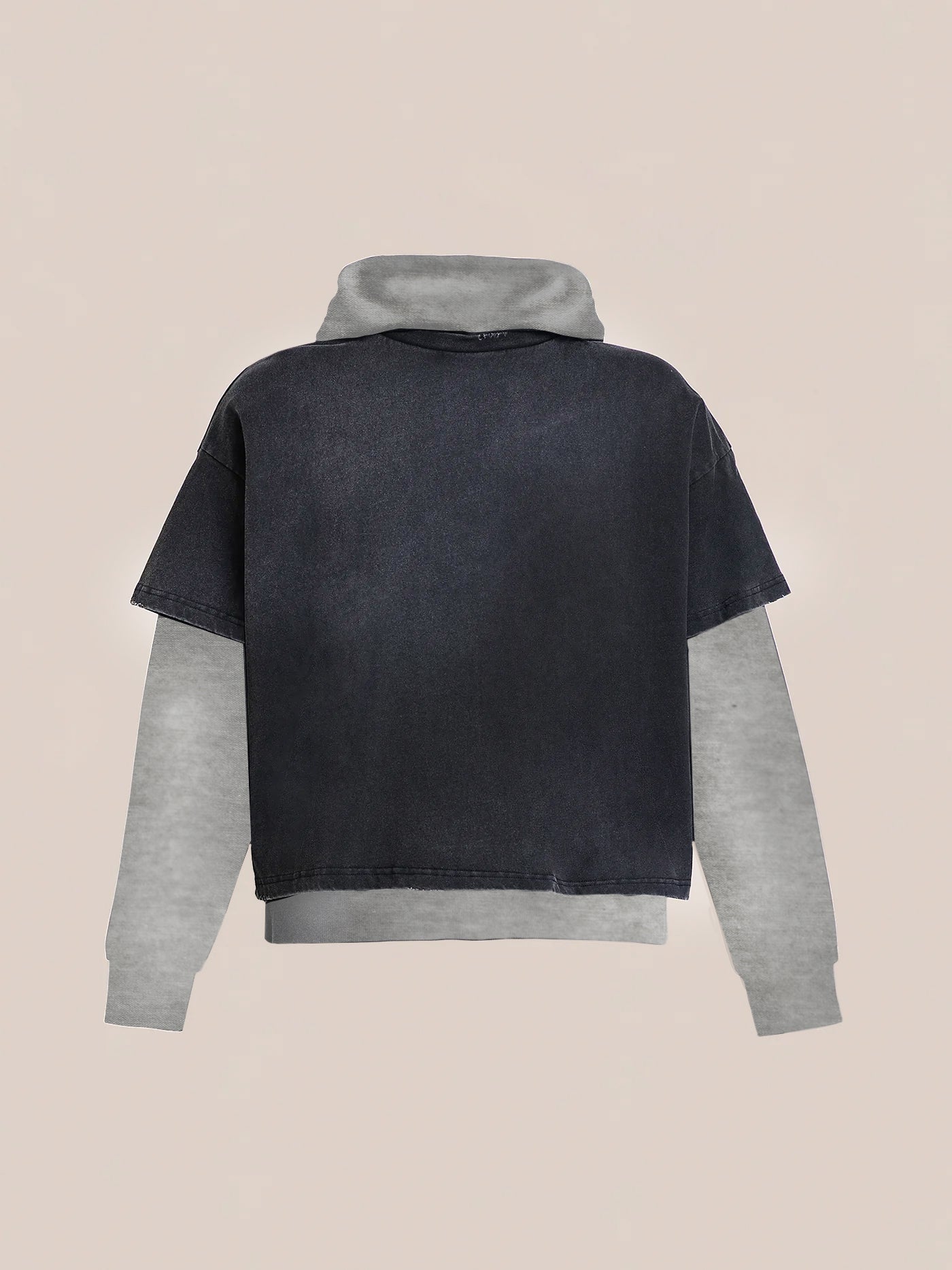 The black short-sleeve T-shirt from the Found Double Layer Hoodie, made of French terry cotton, is layered over a gray long-sleeve hoodie, set against a neutral background for a distinctive double-layer effect.