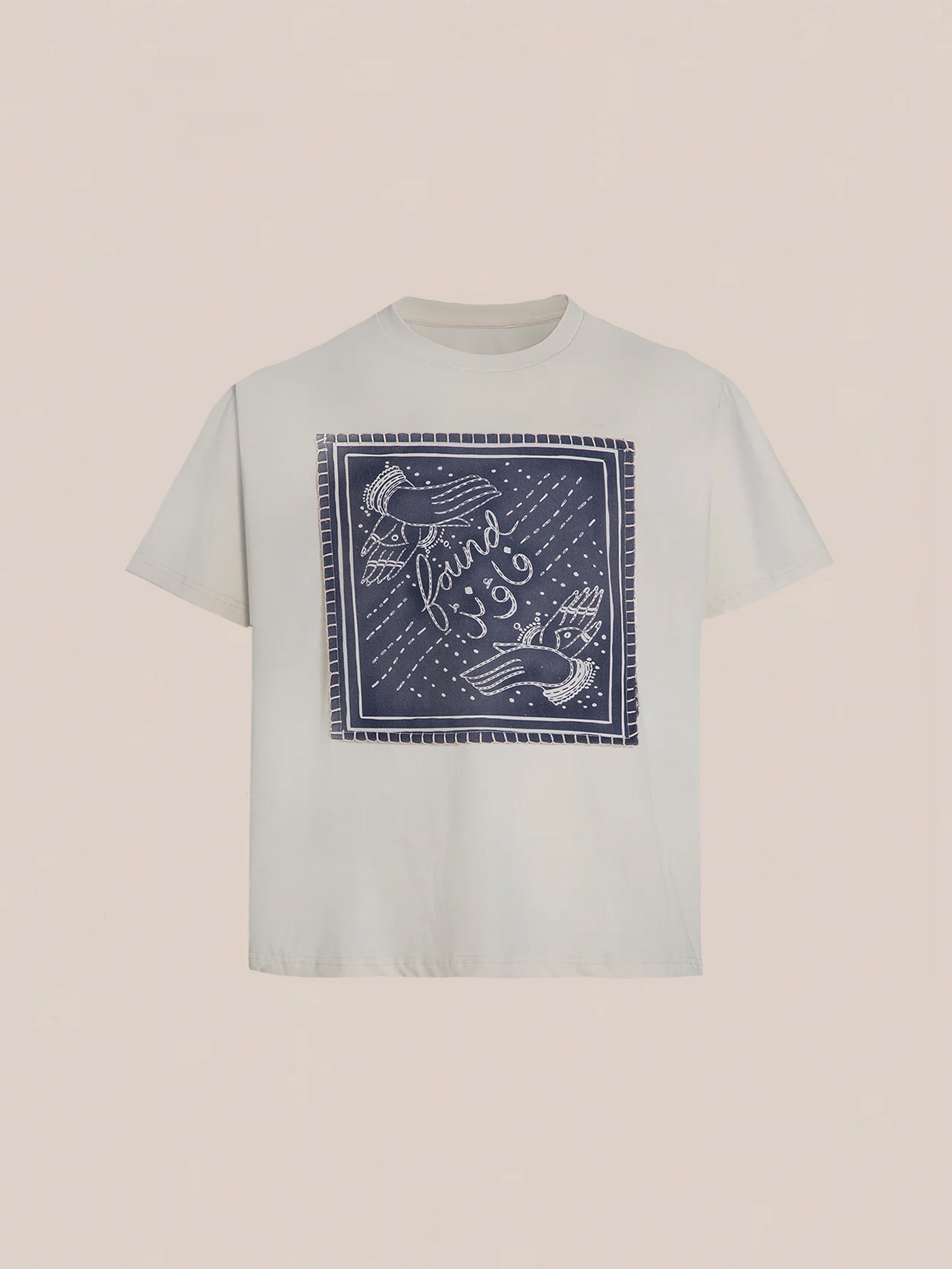 The Hand Art Graphic Tee from FOUND showcases a blue square graphic with birds and the word "found," drawing inspiration from Mughal paintings. Made from soft cotton twill, this white T-shirt adds artistic elegance and comfort to your wardrobe.