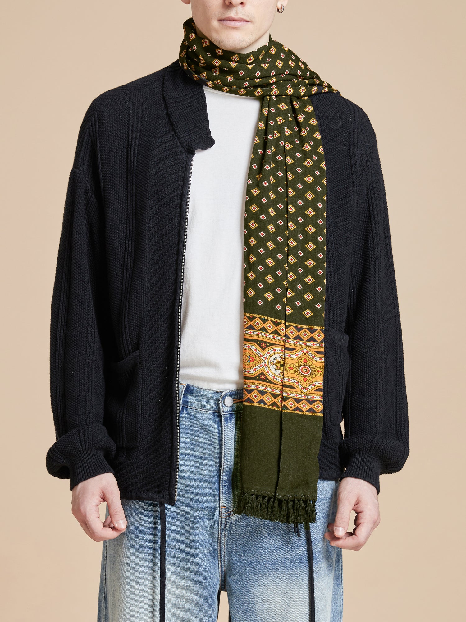 A man wearing a Greener Pastures Scarf by Found.