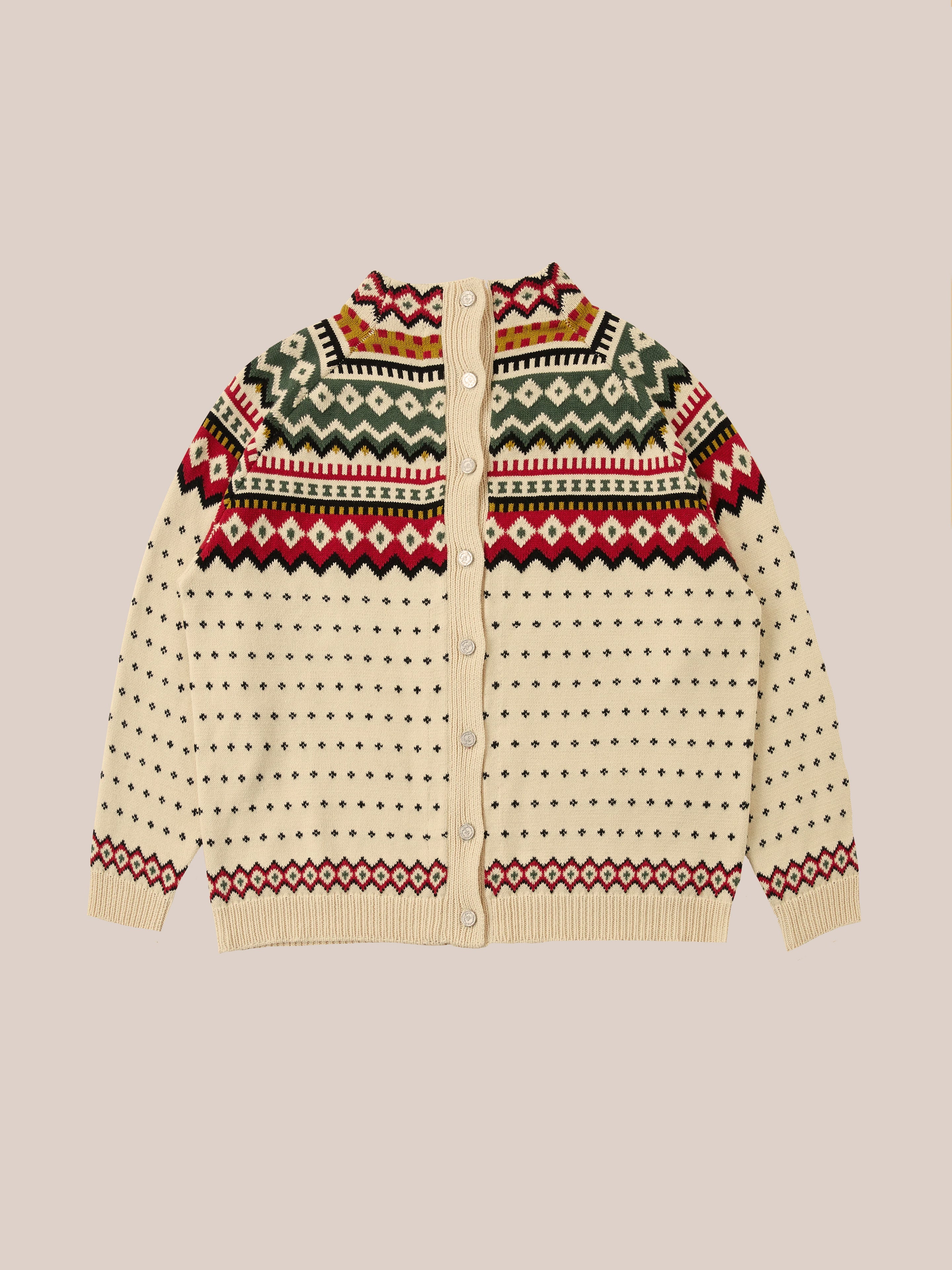 A Harwan Isles Sweater from Found, featuring a cream knit design adorned with a red, green, and black geometric pattern, accented by small black dots and buttons down the front.