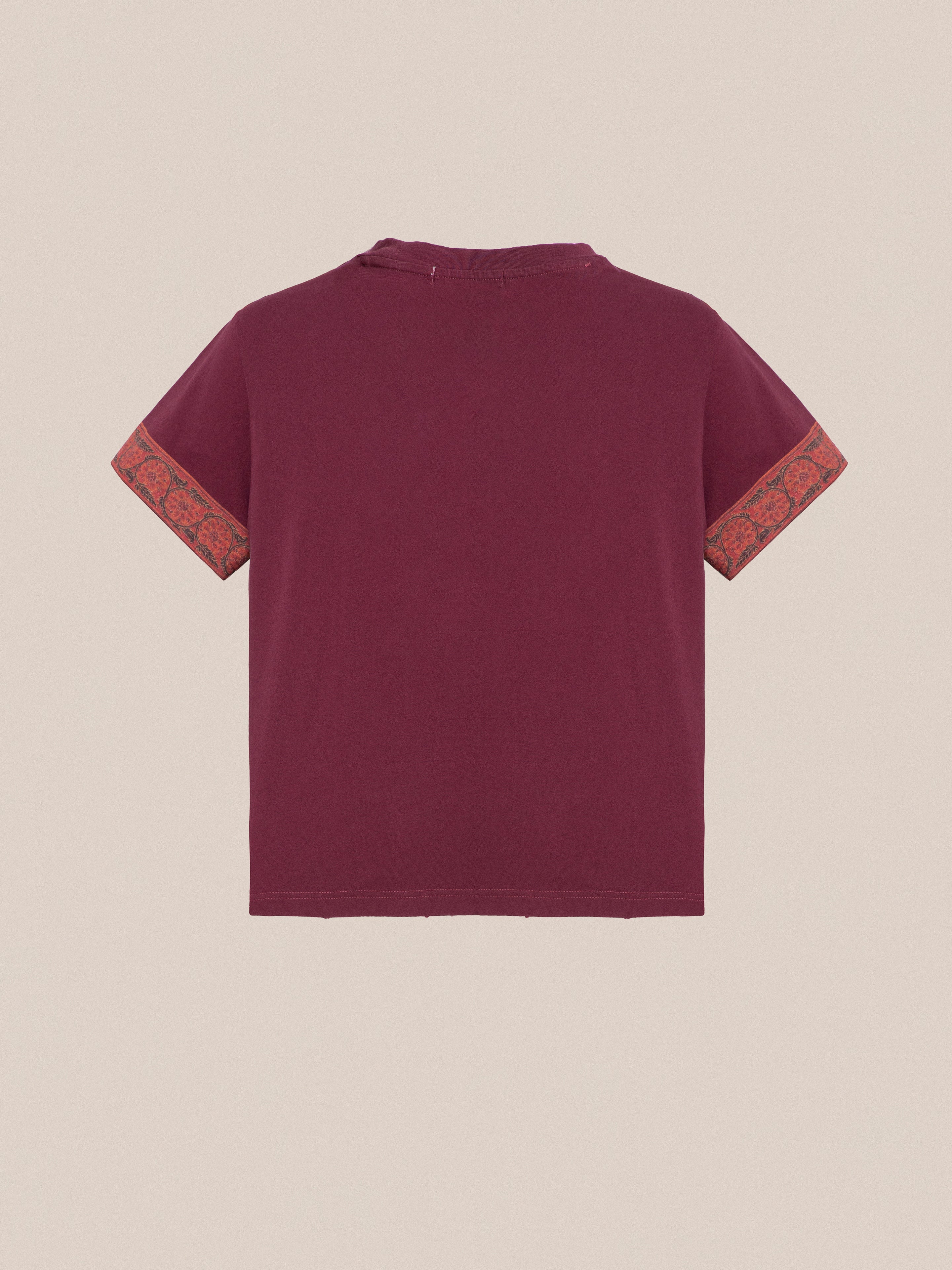 A burgundy Horse Embellishment Tee with an orange trim and floral motifs embellishment by Found.