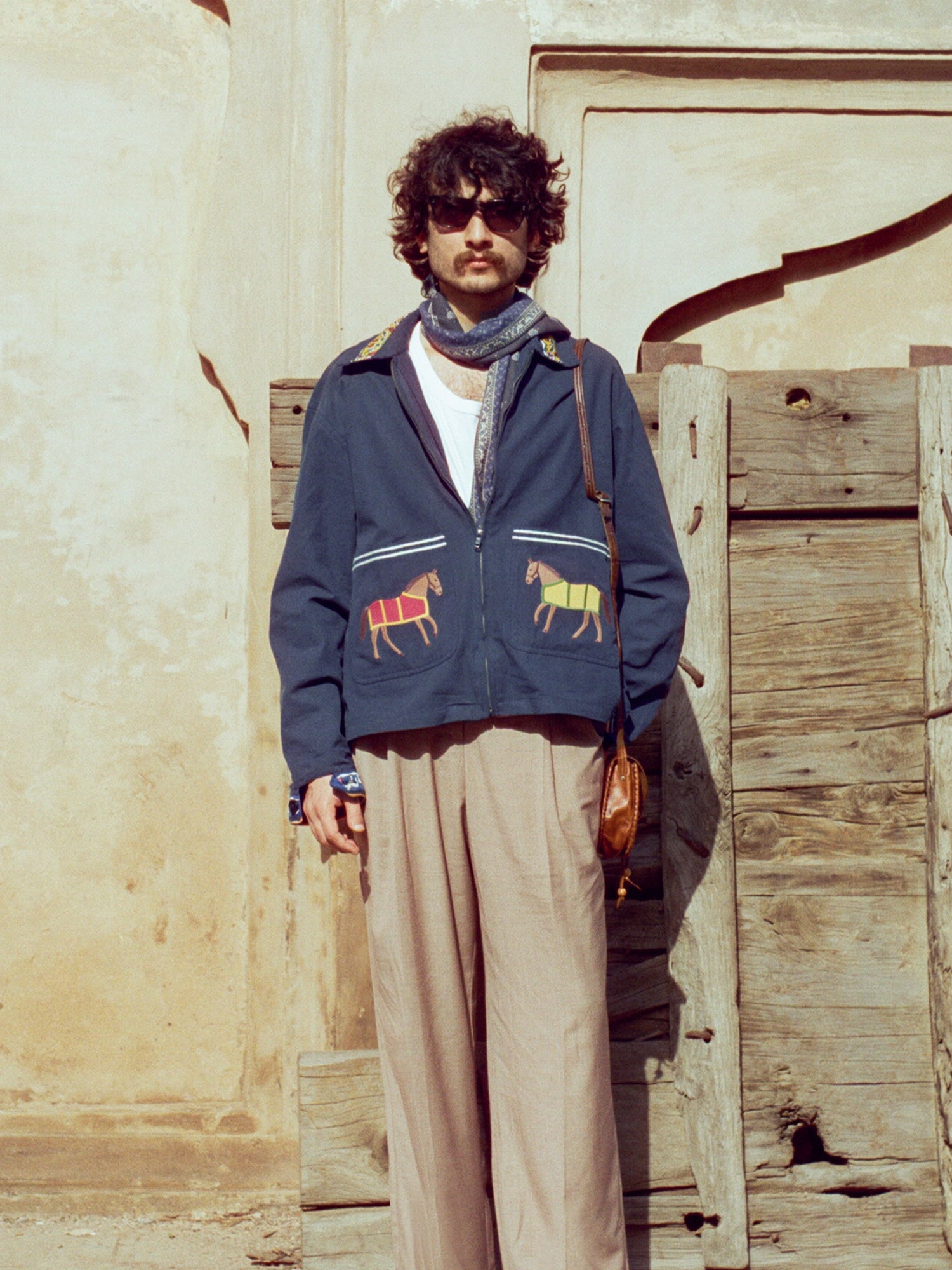 A man wearing a Found Horse Equine Work Jacket.