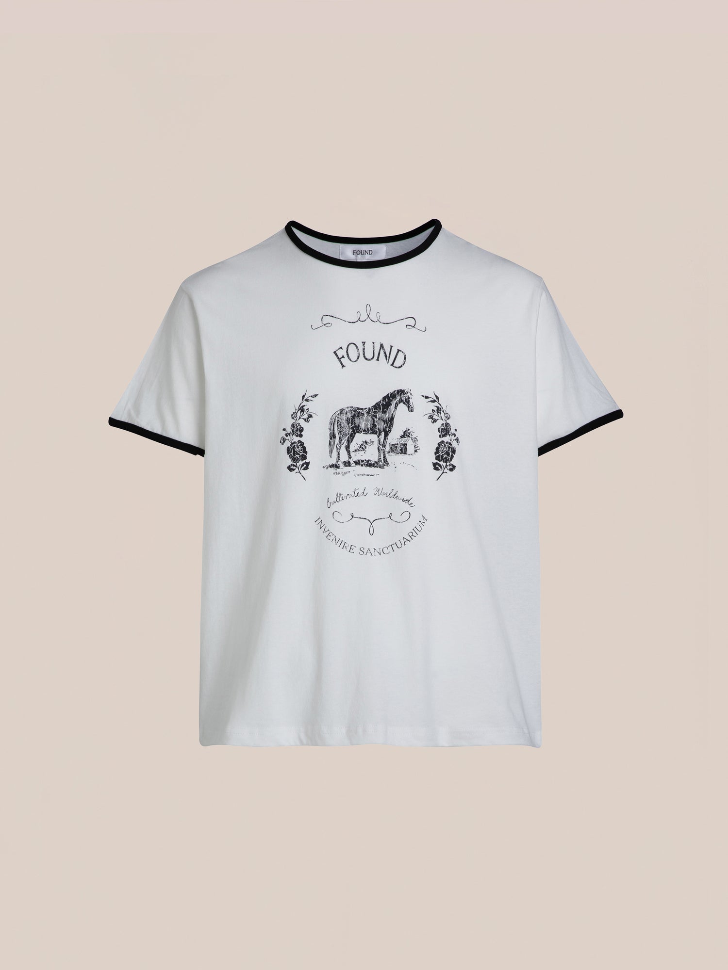 Horse Crest Ringer Tee by FOUND featuring a white base with black trim and an illustration of a donkey adorned with floral elements. The design includes the text 