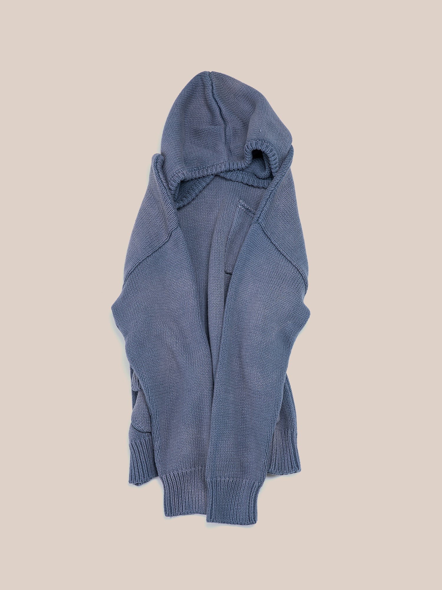 A blue "Faded Knit Pocket Hoodie" from the brand FOUND, featuring an oversized fit, is displayed against a plain background.