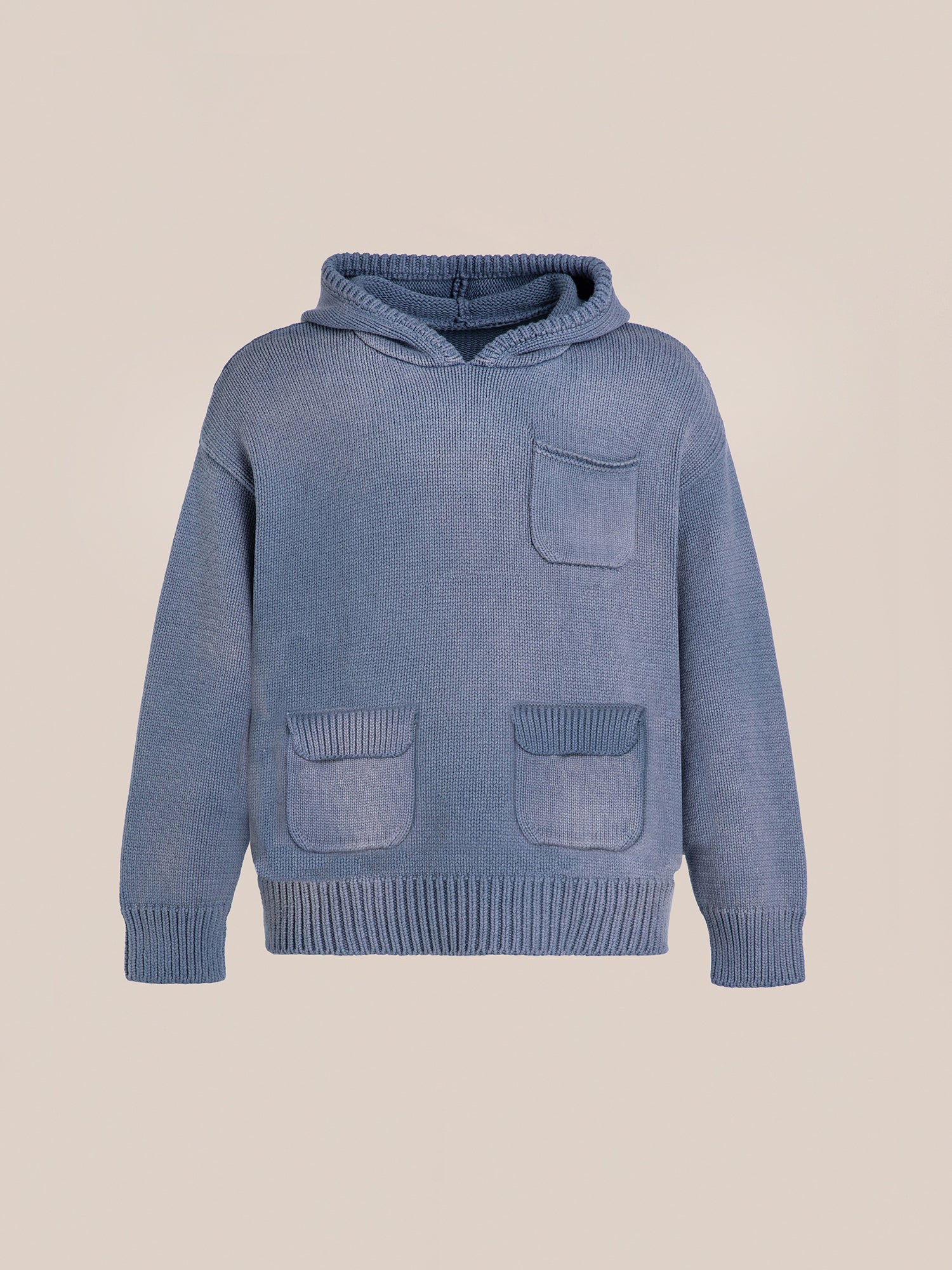 The Faded Knit Pocket Hoodie by FOUND is an oversized hoodie crafted from 100% cotton, featuring a faded blue design. It includes one chest pocket and two front pockets, showcased on a plain background.