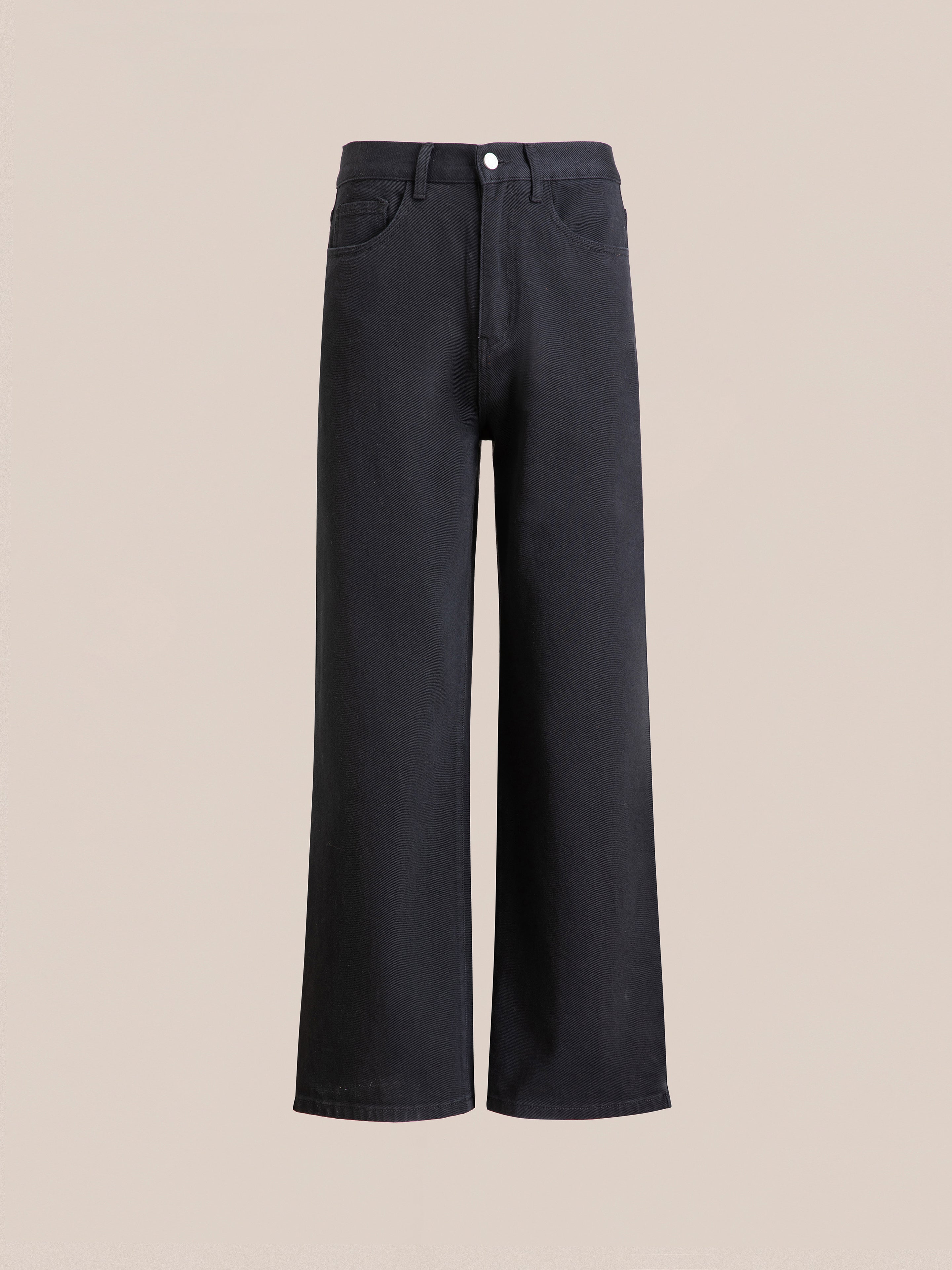 FOUND presents the Lacy Baggy Jeans, a pair of black wash wide-leg jeans featuring a high waist configuration with front button and zipper closures. These stylish jeans include two front pockets and are showcased against a plain beige background.