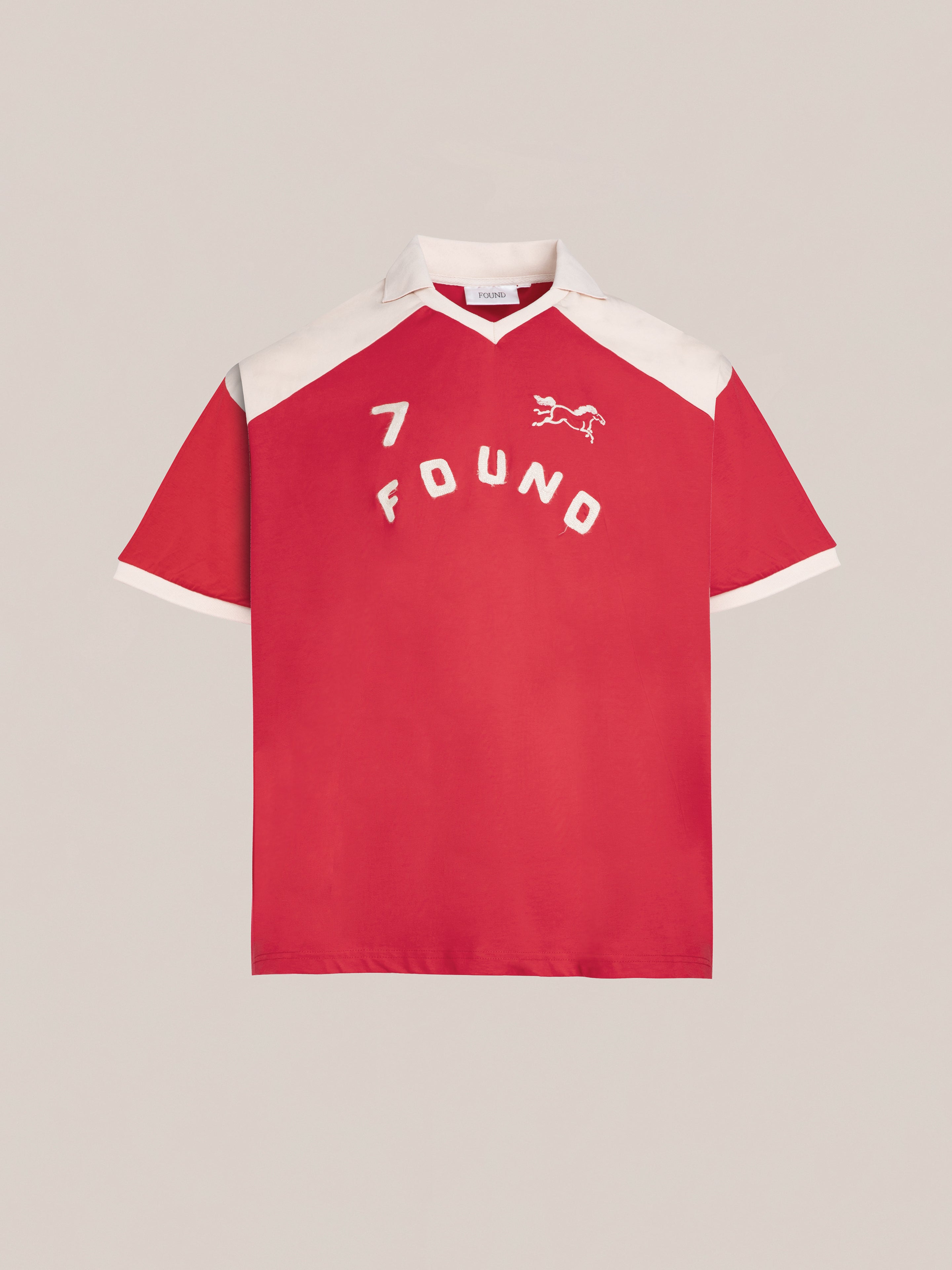 Introducing the Goji Red Jersey by FOUND, showcasing white contrast color yoke and collar, featuring the number 7. This stylish piece includes a small horse graphic and the brand name "FOUND" in vintage athletic uniform style on the front.