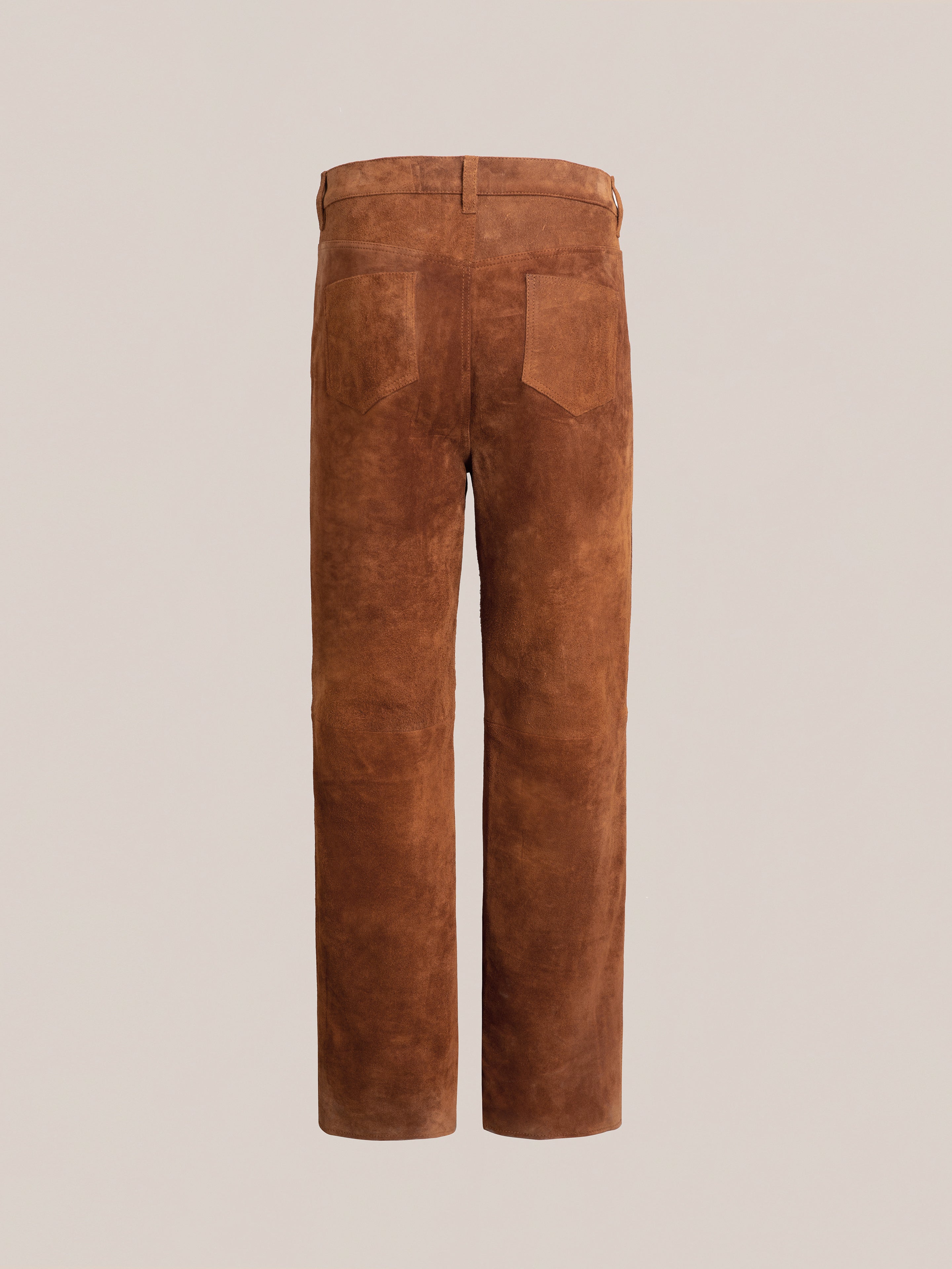 The FOUND Suede Moto Pants, displayed from the back, showcase two rear pockets and belt loops. These fashionable brown pants are crafted from ethically sourced materials, making them a perfect blend of style and responsibility.