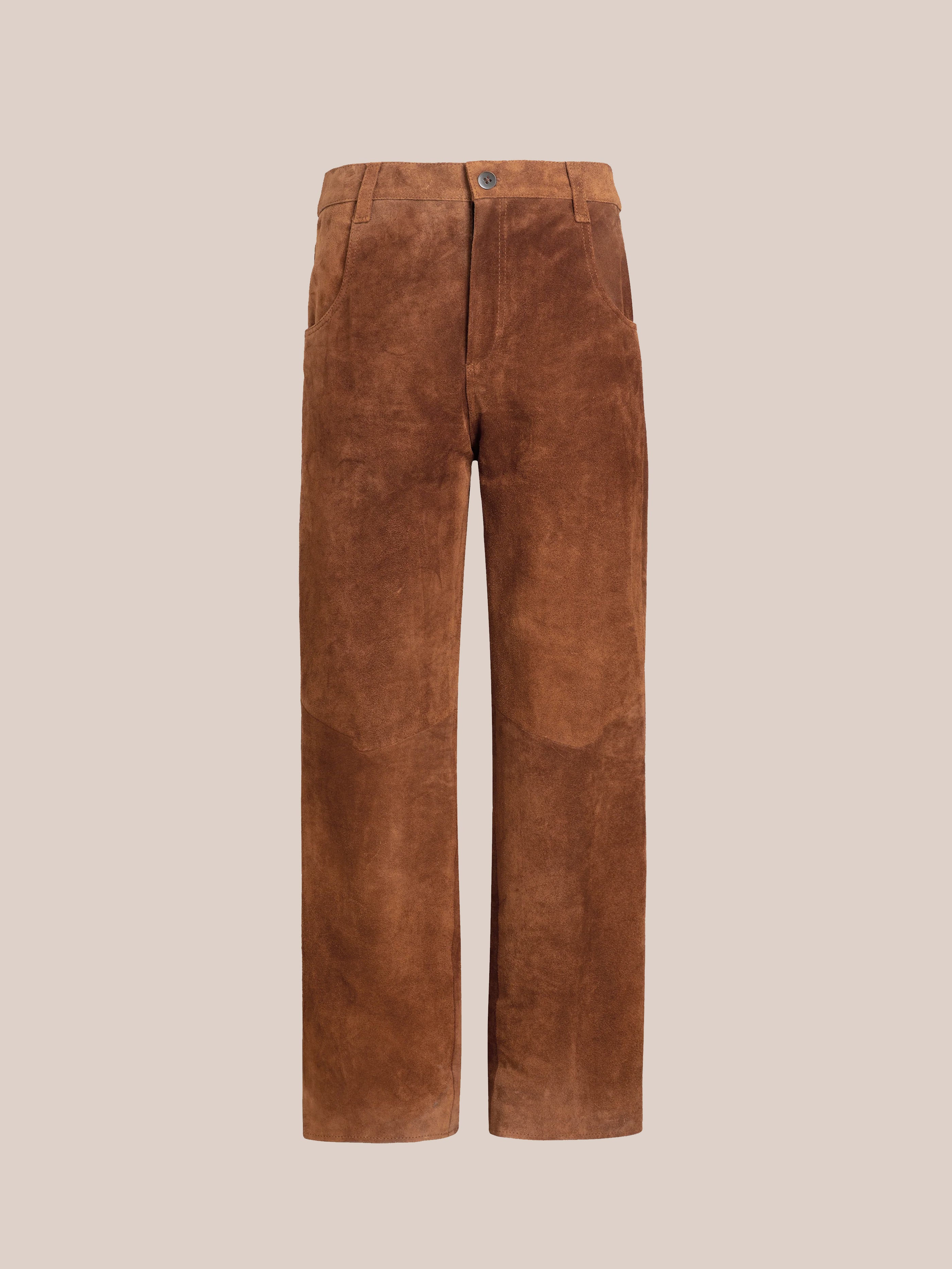 The Suede Moto Pants by FOUND are brown and crafted from ethically sourced materials. They feature a button and zipper closure, front pockets, and straight legs against a light beige background.