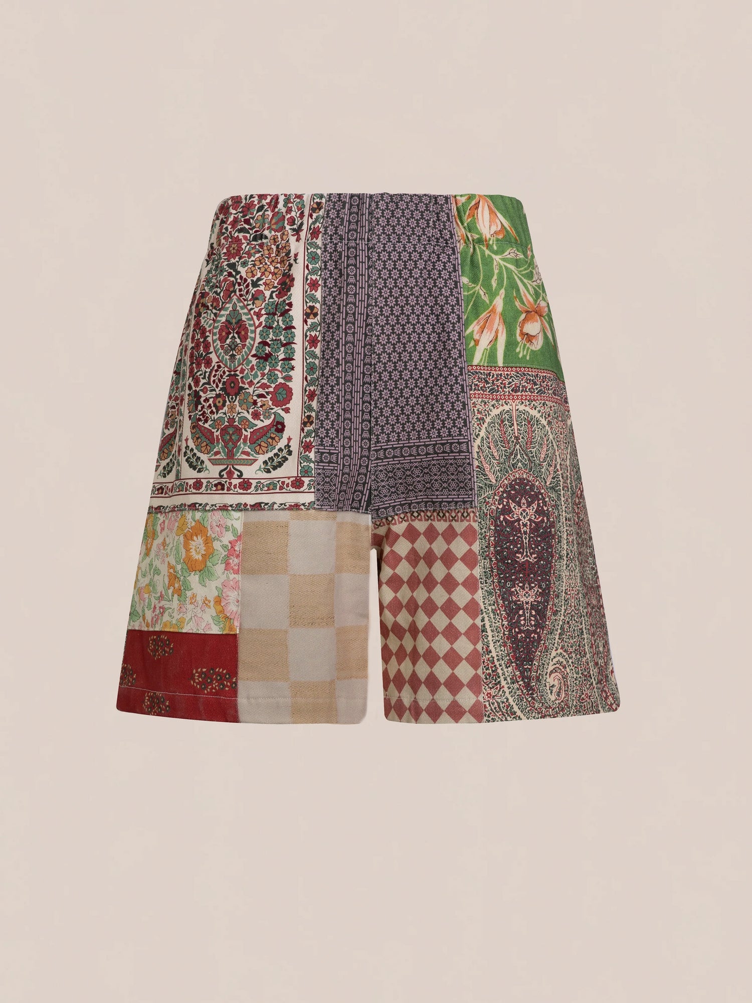 Tapestry Twill Shorts by FOUND featuring a variety of vibrant patterns such as florals, checkers, and geometric designs on a light beige background.