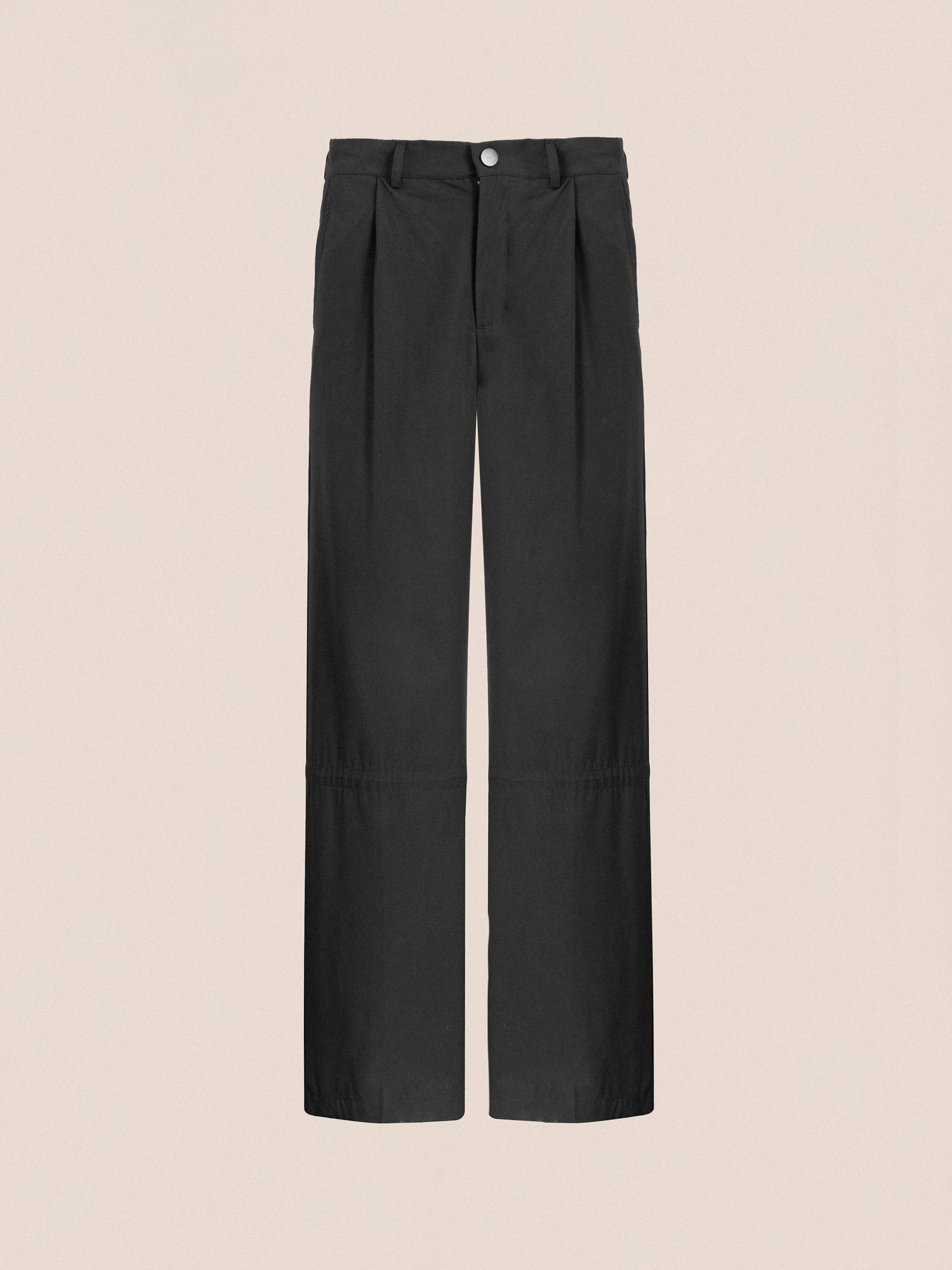 Found Tencel Pleated Pants with a button closure, displayed against a plain light pink background.